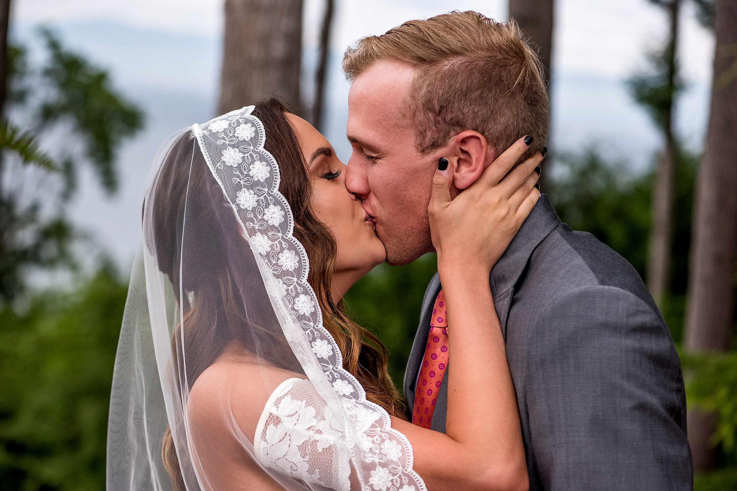 The first kiss at a backyard wedding in BC - Qualicum Wedding Photographer