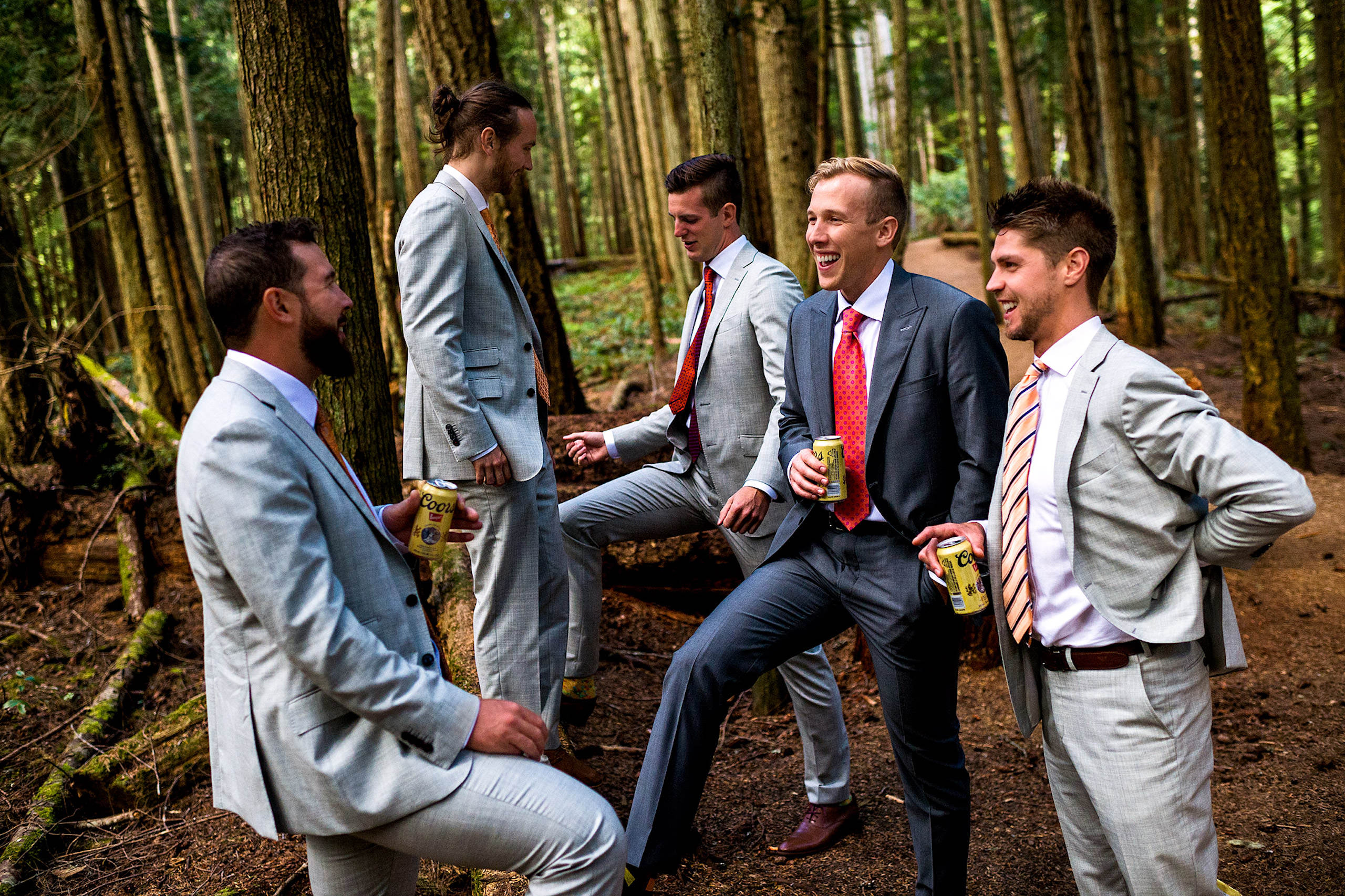 Groomen standing in the forest drinking beers in BC - Qualicum Wedding Photographer