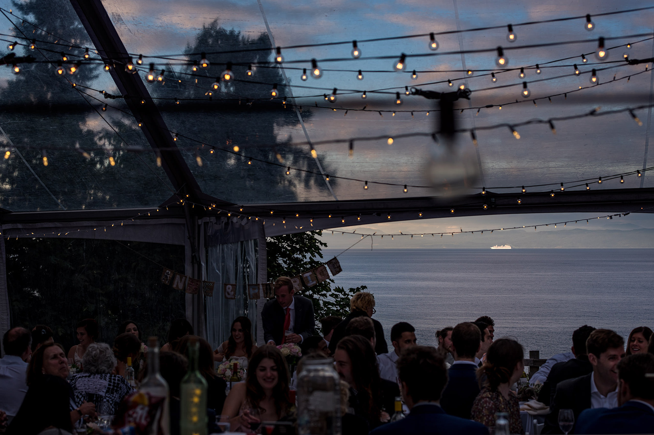 A large cruise ship in the distance at a BC wedding - Qualicum Wedding Photographer