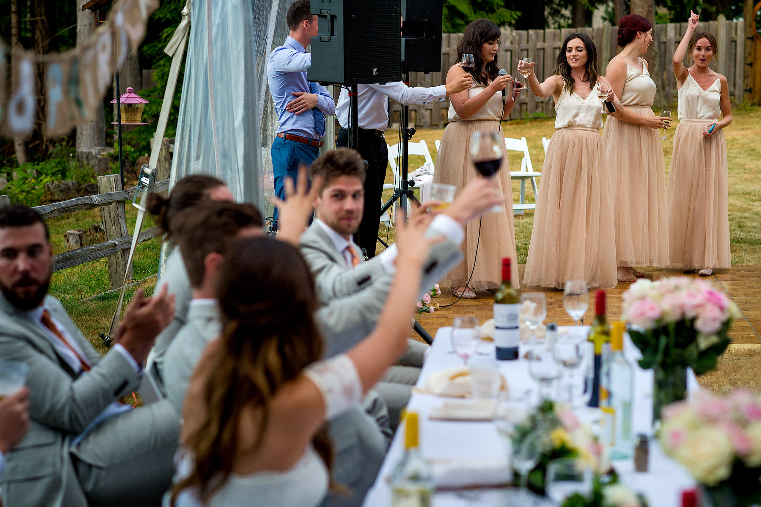 Bridesmaids giving a speech at a backyard wedding in BC - Qualicum Wedding Photographer