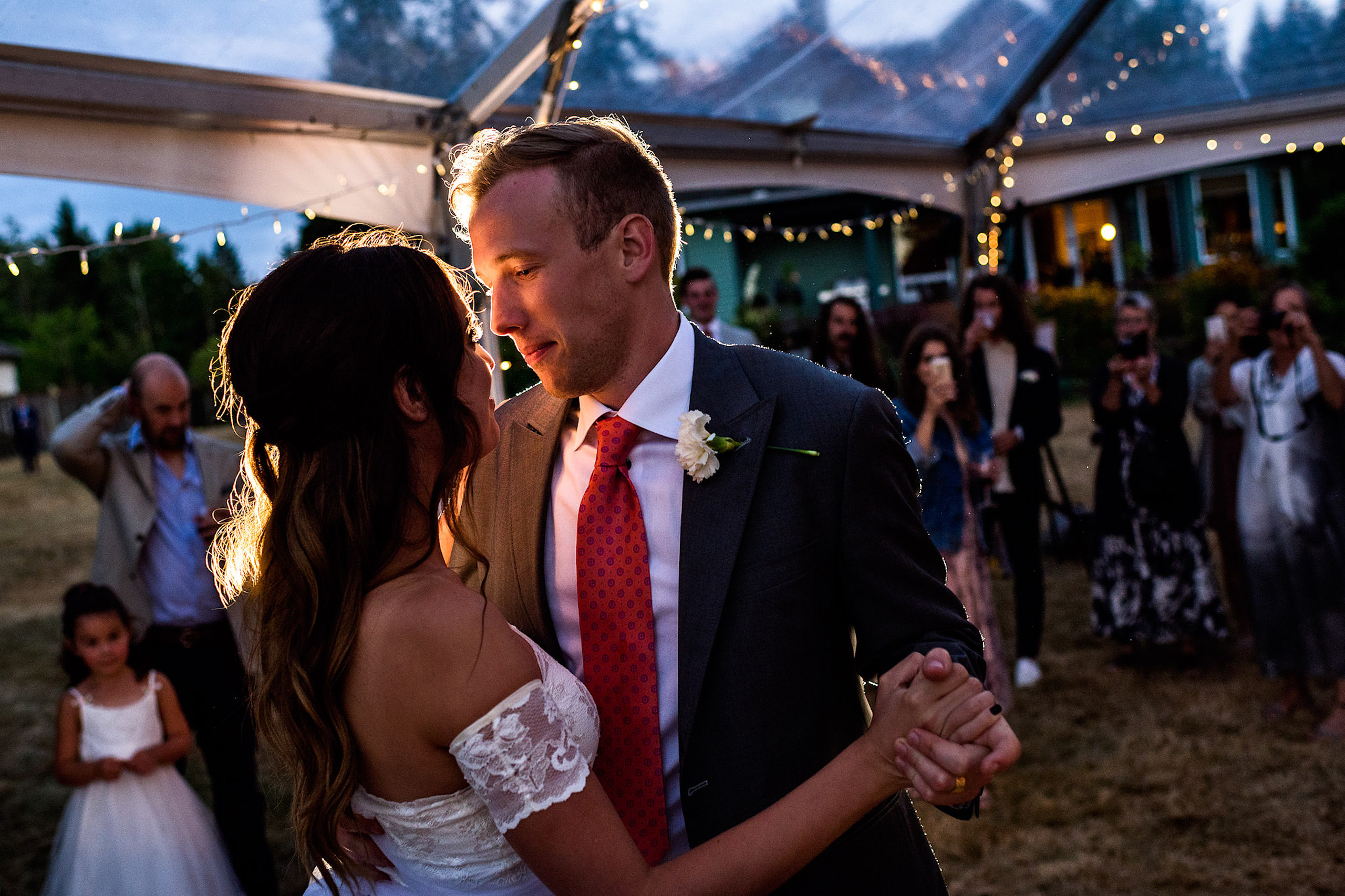 Bride and groom first dance in a tent in their backyard - Qualicum Wedding Photographer