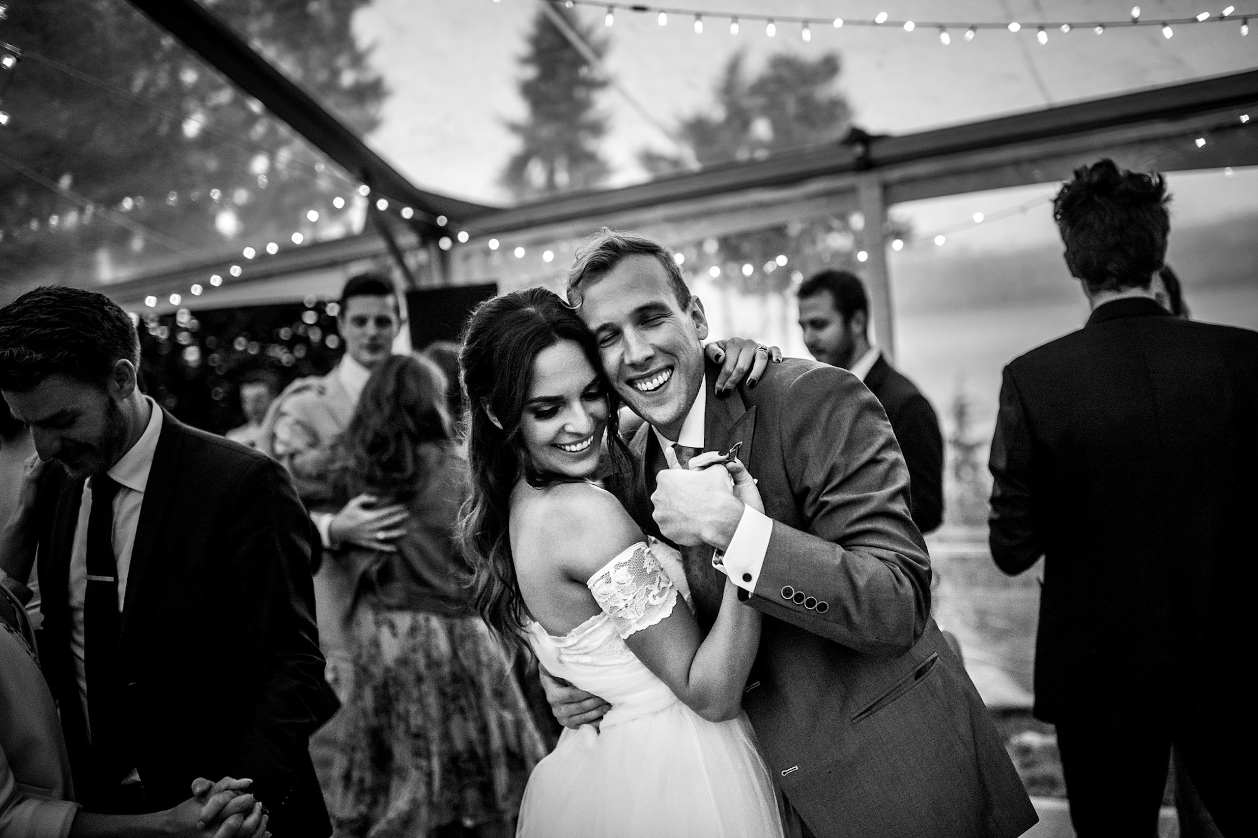 bride and groom sharing a special moment at their backyard tent wedding - Qualicum Wedding Photographer