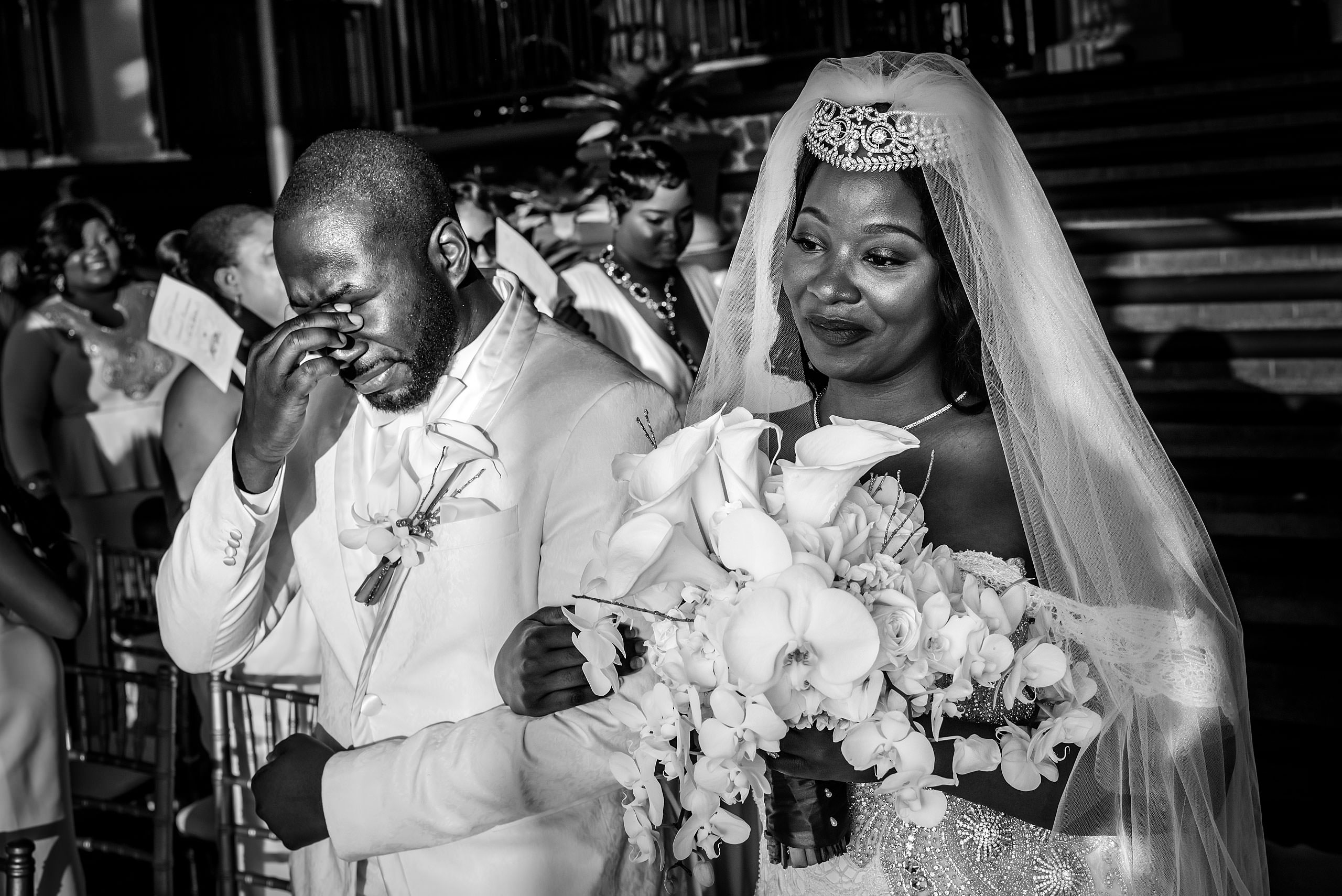 a groom crying while walking his bride down the aisle at Zephyr Palace Destination Wedding in Costa Rica by Sean LeBlanc