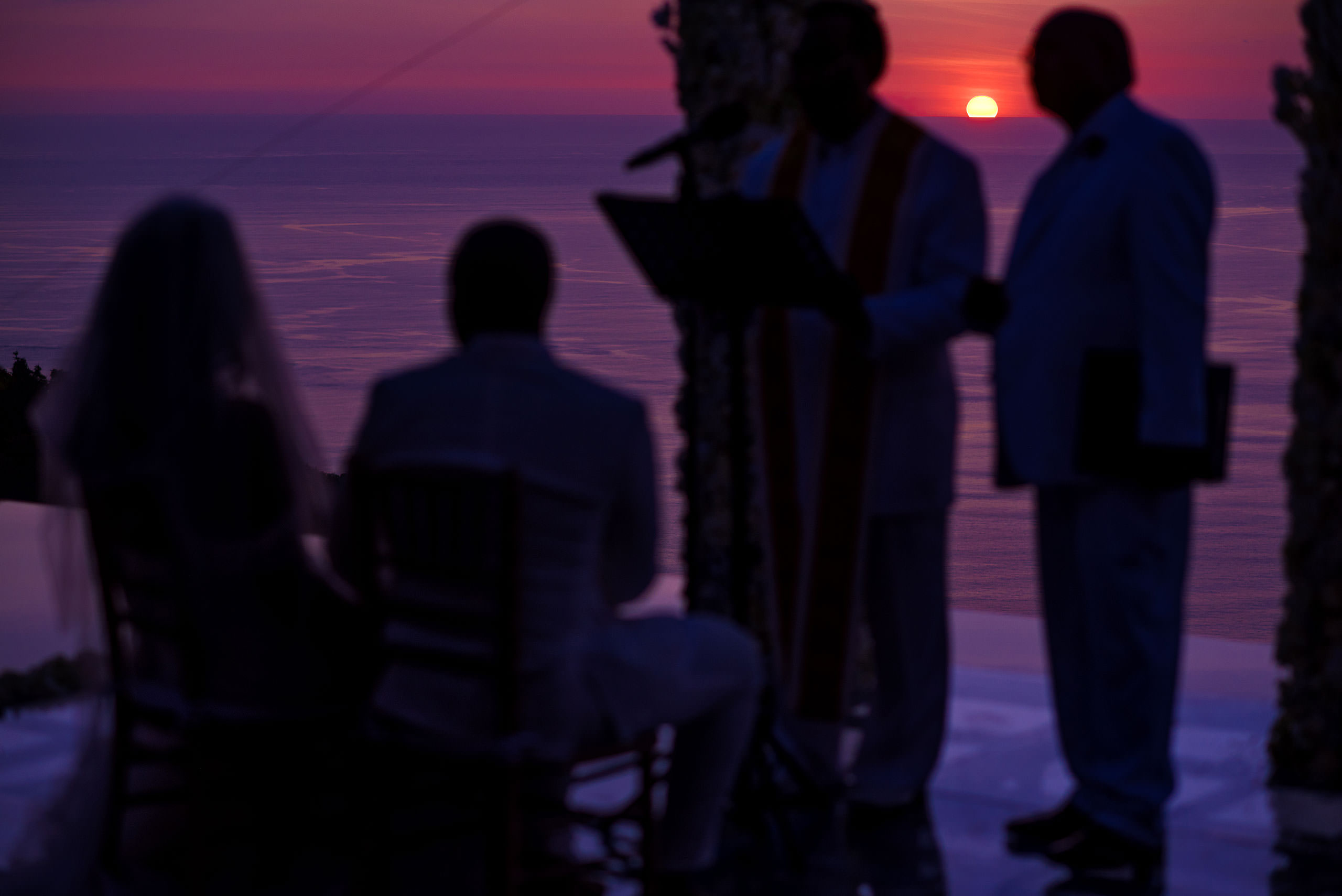 the sun setting at a ceremony at Zephyr Palace Destination Wedding in Costa Rica by Sean LeBlanc