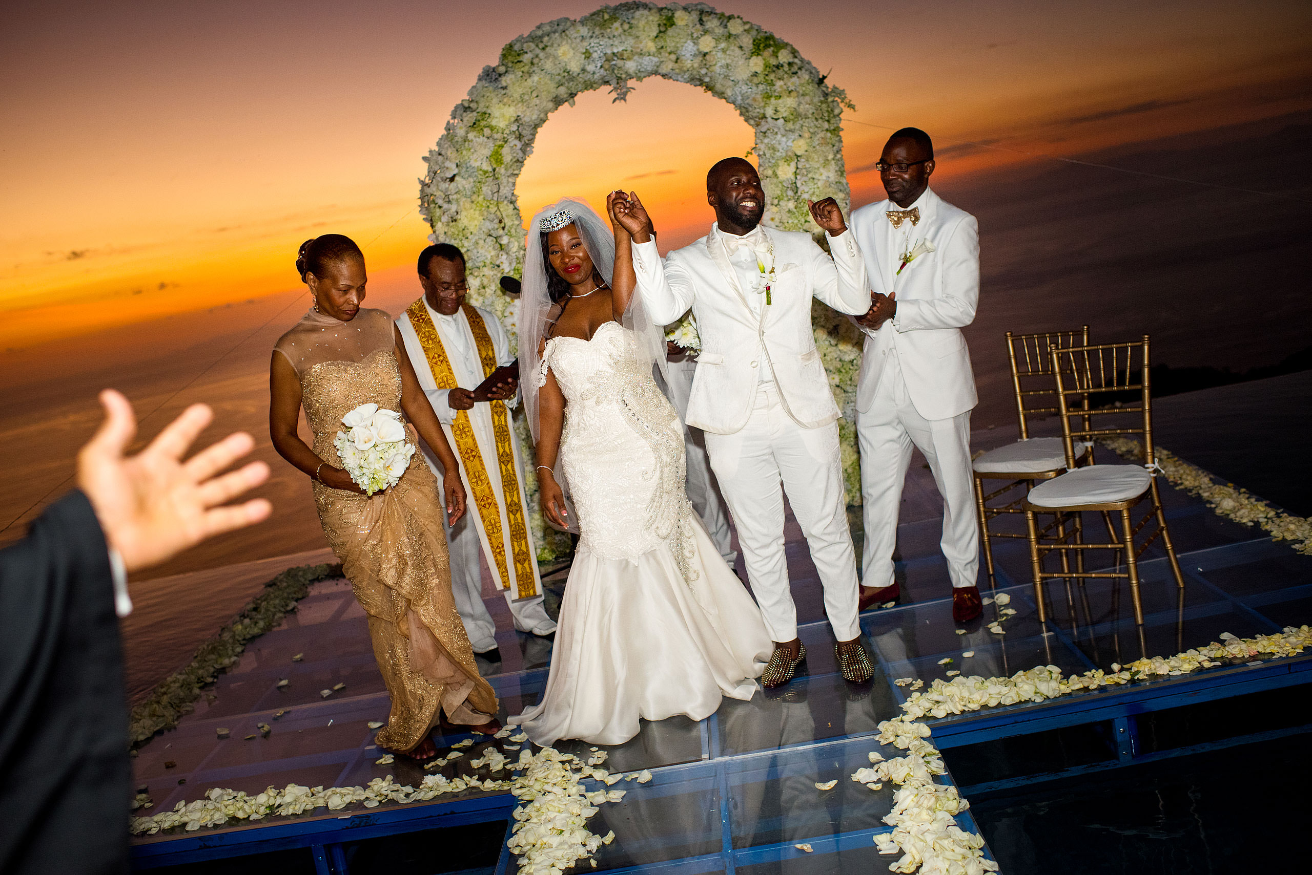 bride and groom celebrating after their ceremony by destination wedding photographer