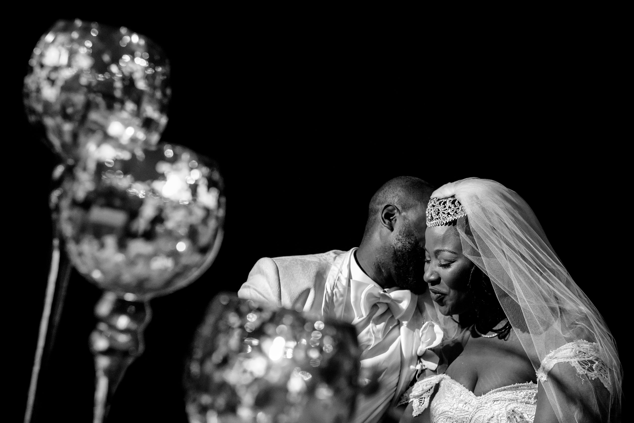 a groom whispering in his brides ear at Zephyr Palace Destination Wedding in Costa Rica by Sean LeBlanc