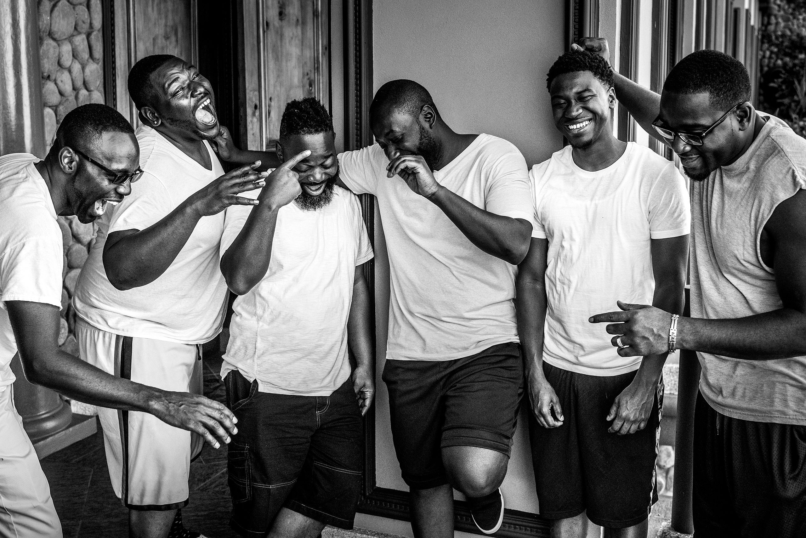 groomsmen joking around before a wedding day at Zephyr Palace Destination Wedding in Costa Rica by Sean LeBlanc