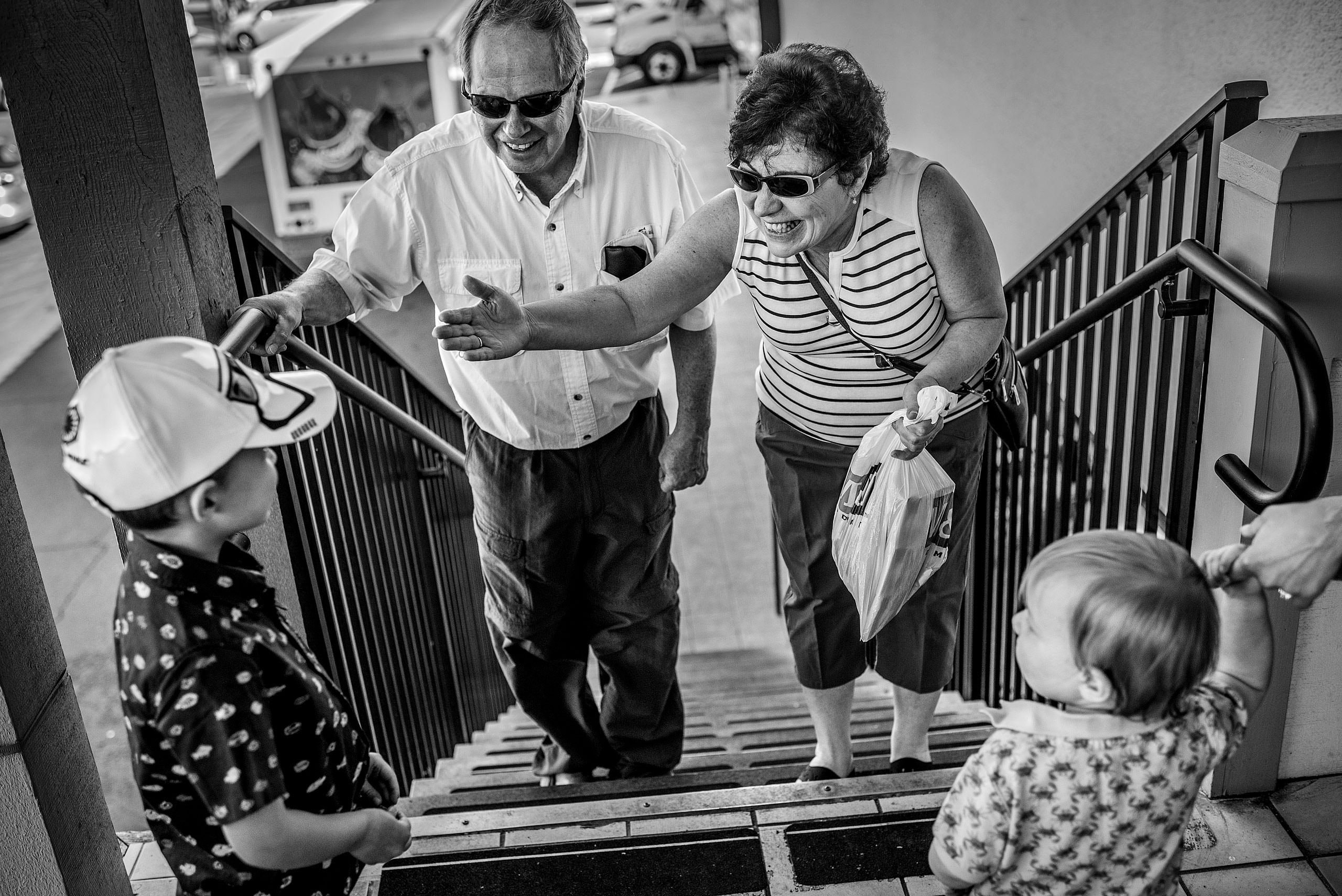 two grandparents seeing their grandchildren by destination family photographers sean leblanc