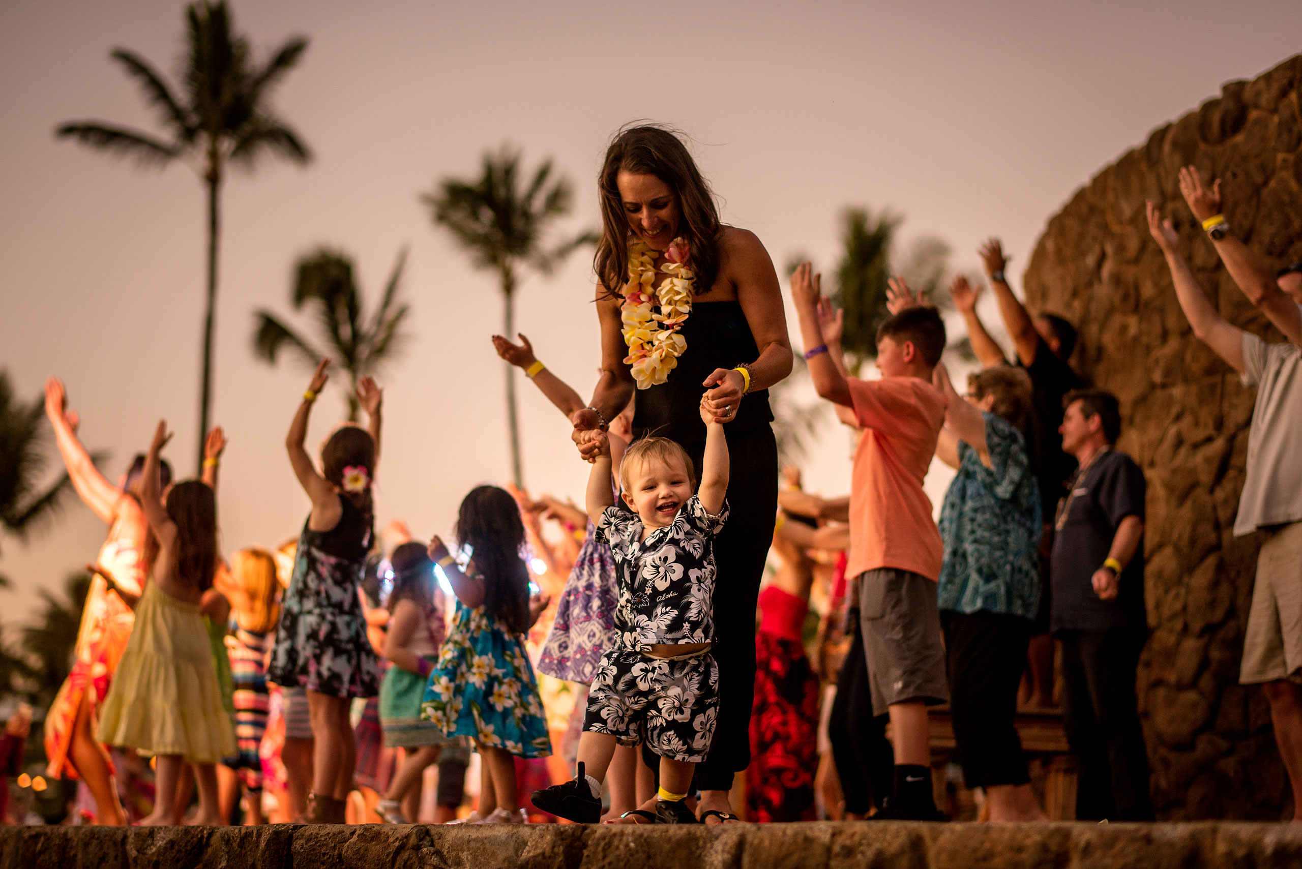 a mom dancing with her son by destination family photographers sean leblanc