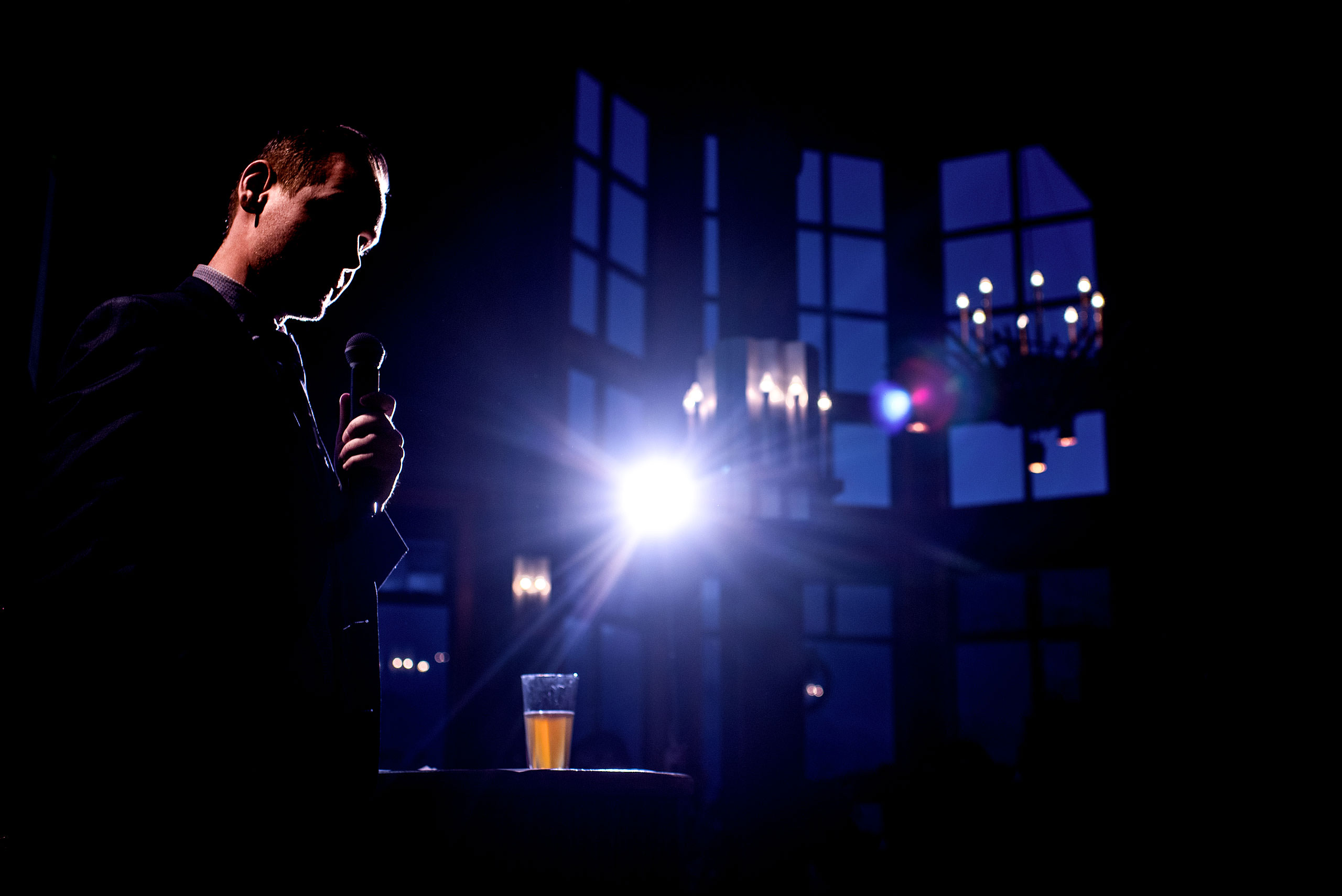 an MC giving a speech at a reception at a winter kicking horse wedding by sean leblanc