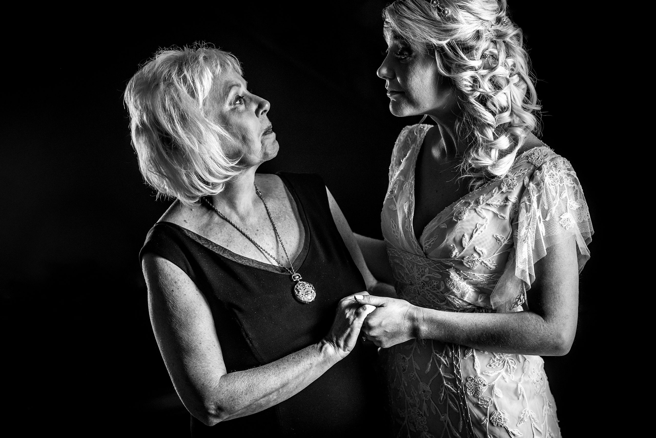 mom and daughter having a moment at winter kicking horse wedding