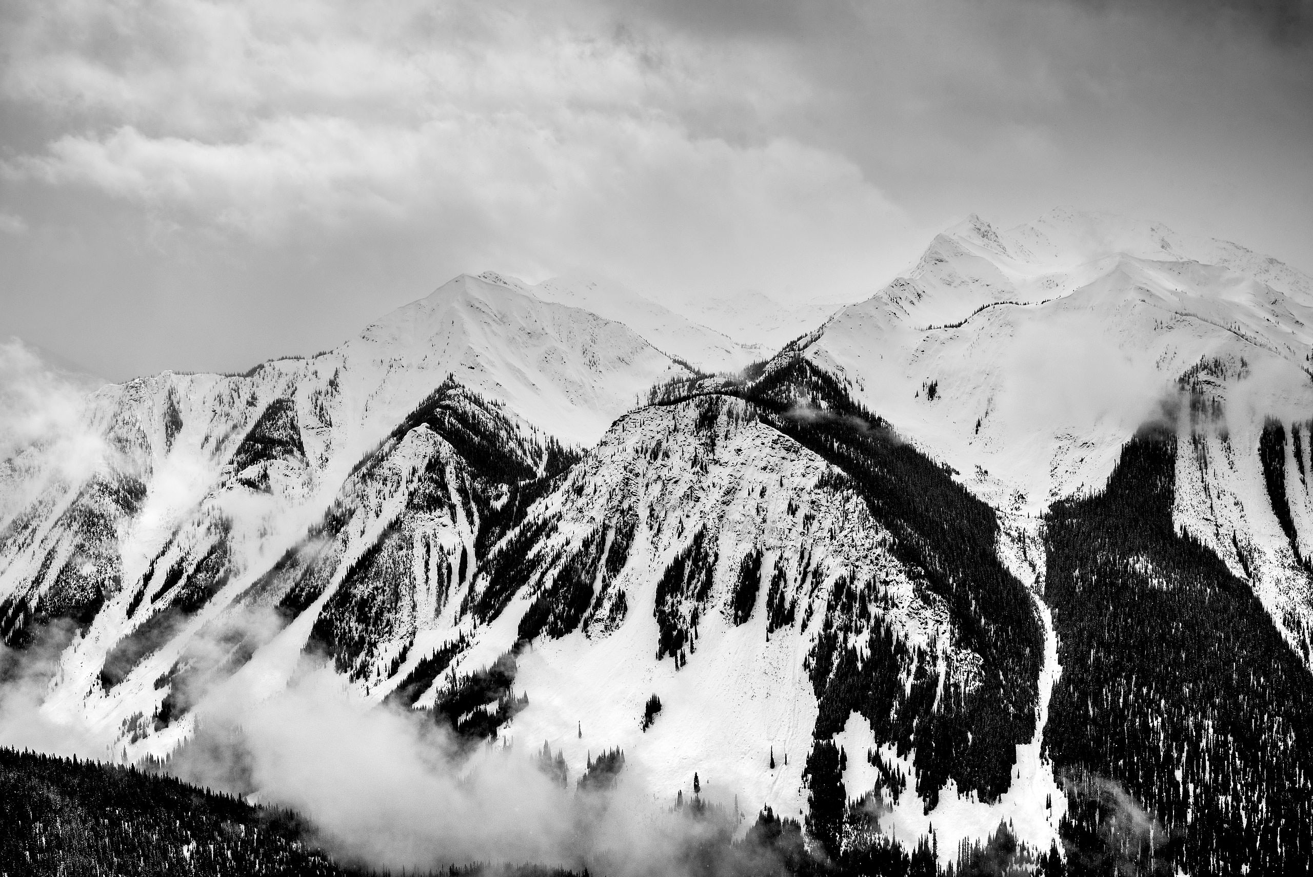 a mountain range at a winter kicking horse wedding by sean leblanc