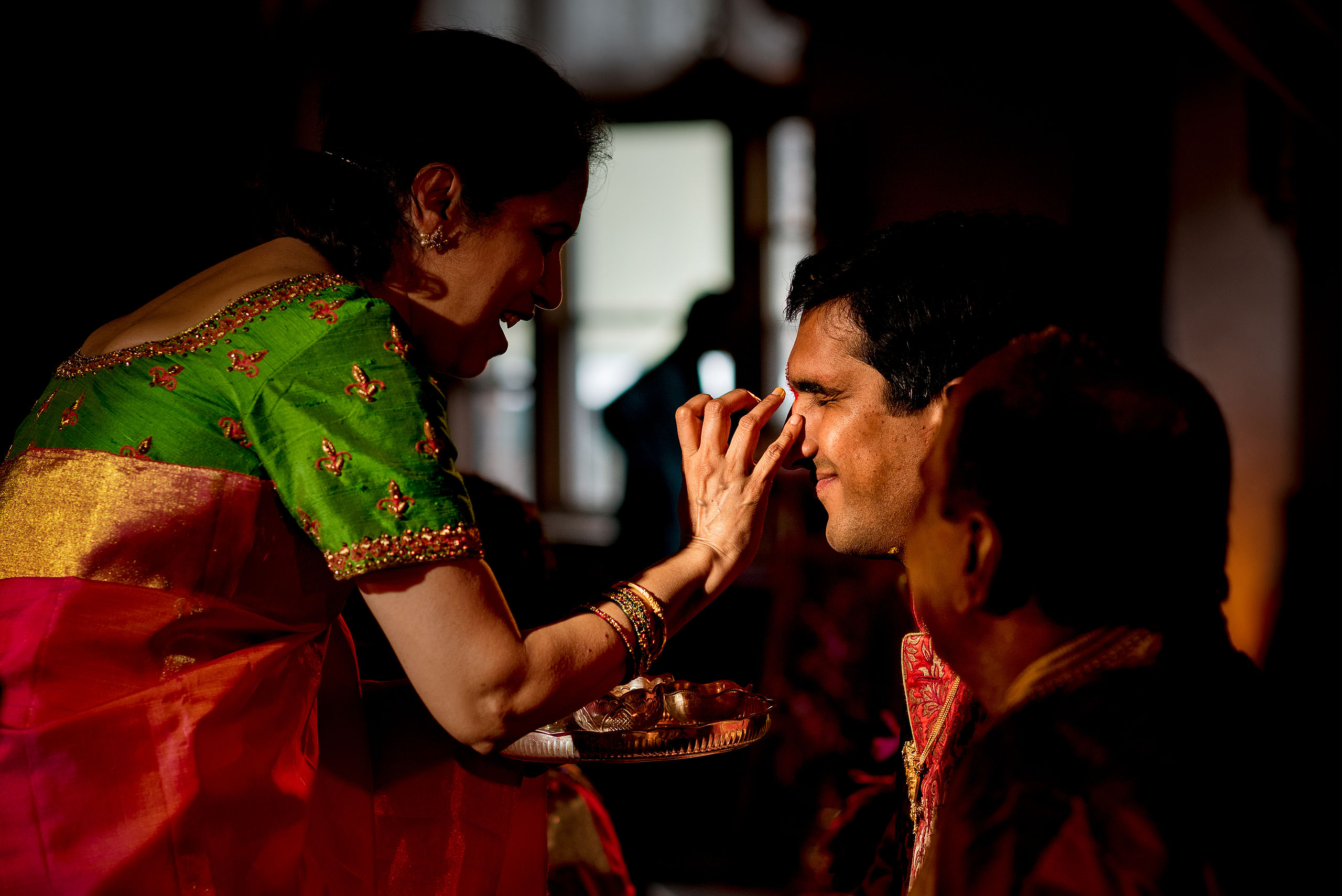a grooms mom at a traditional indian ceremony for cascade ballroom banff springs wedding by sean leblanc