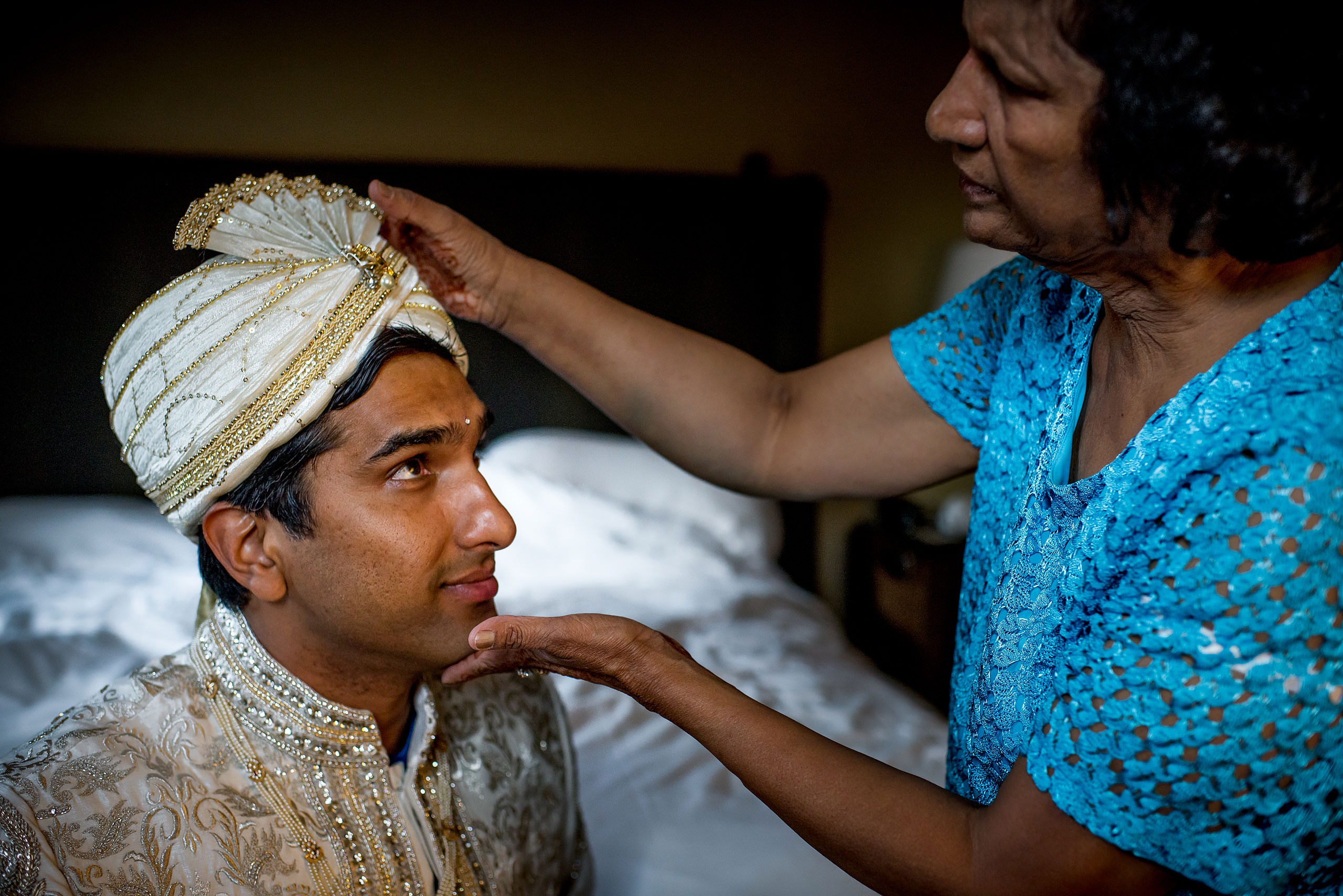 indian groom looking at his mom for cascade ballroom banff springs wedding by sean leblanc