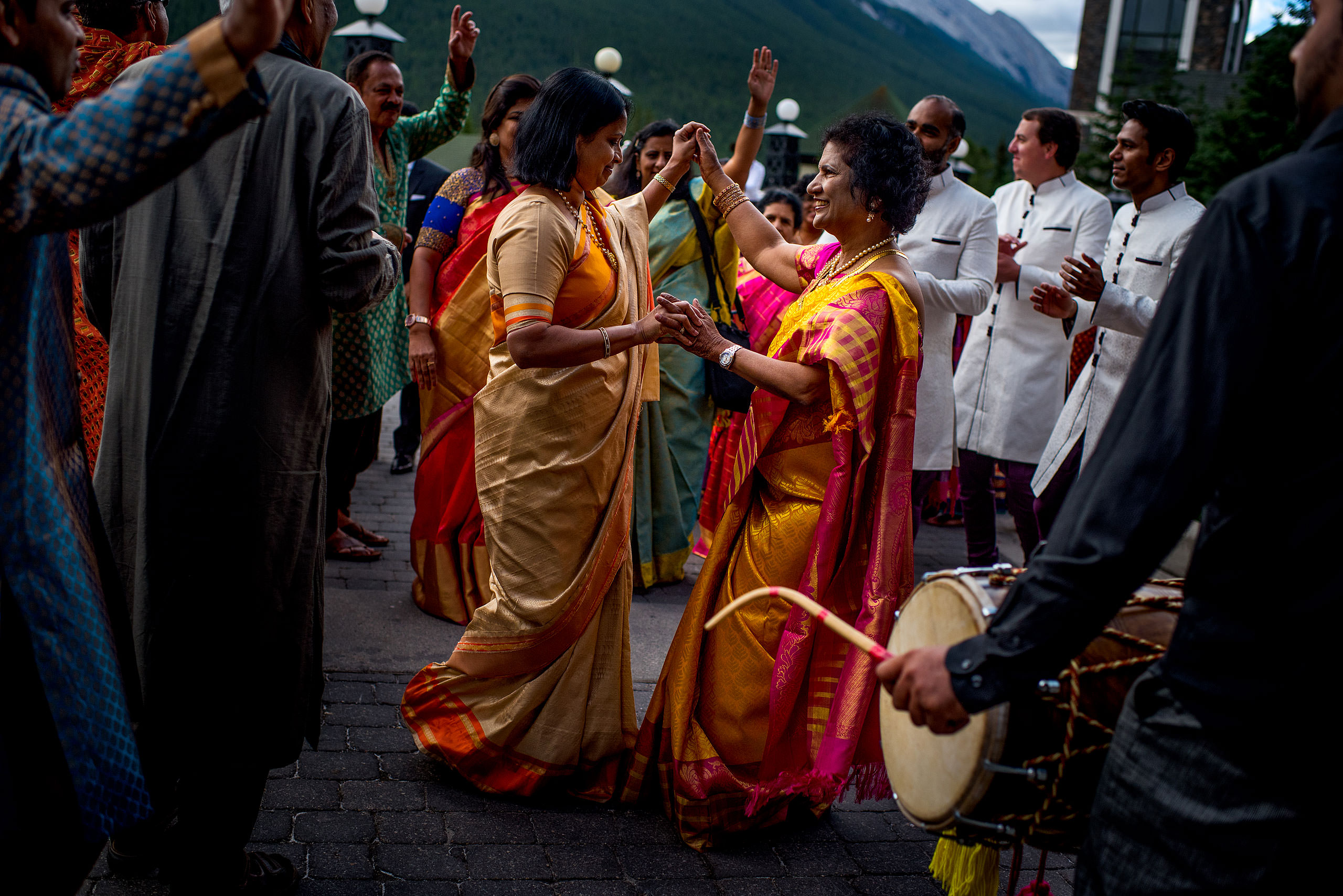 indian women dancing together for cascade ballroom banff springs wedding by sean leblanc