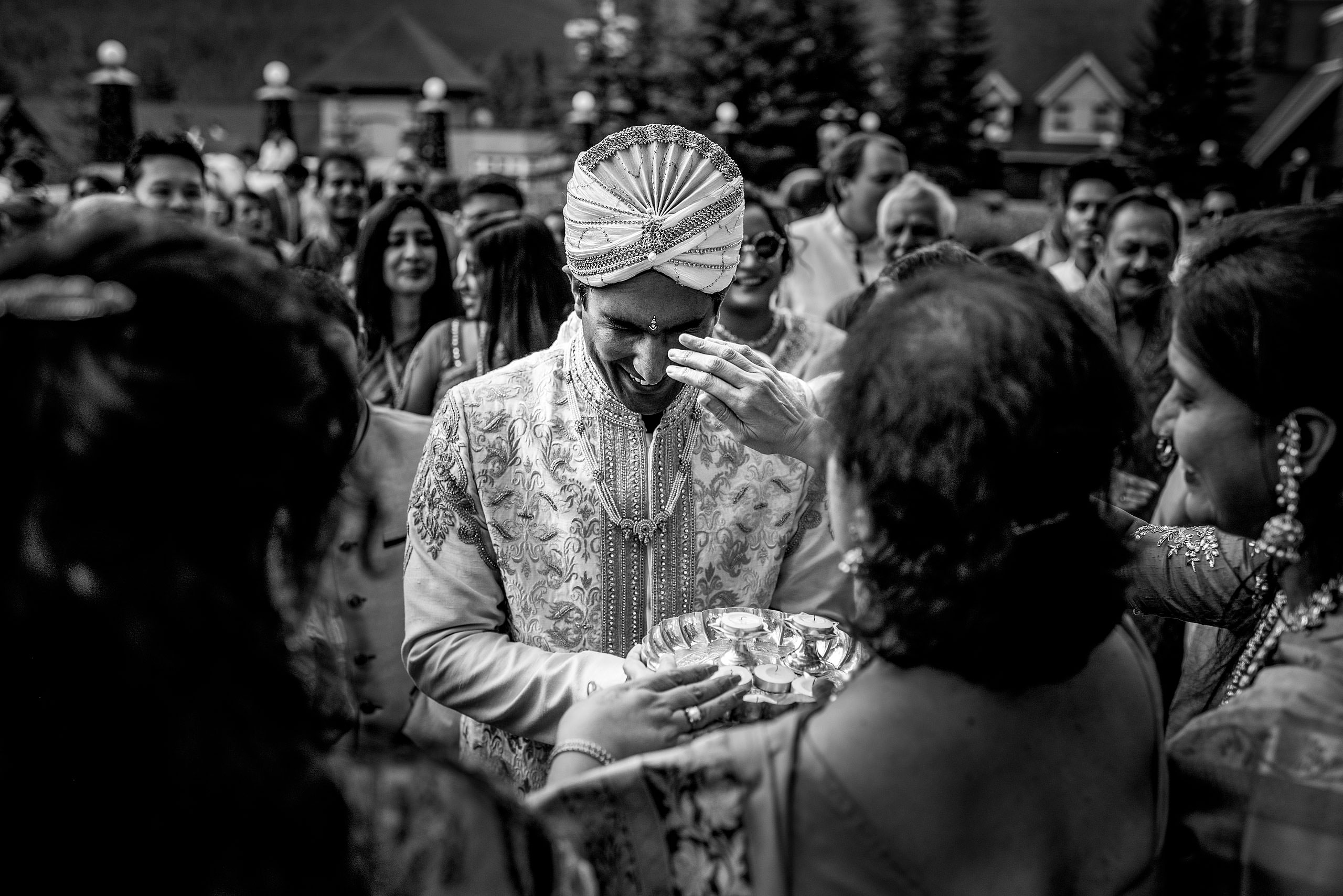 paint being applied to indian groom for cascade ballroom banff springs wedding by sean leblanc