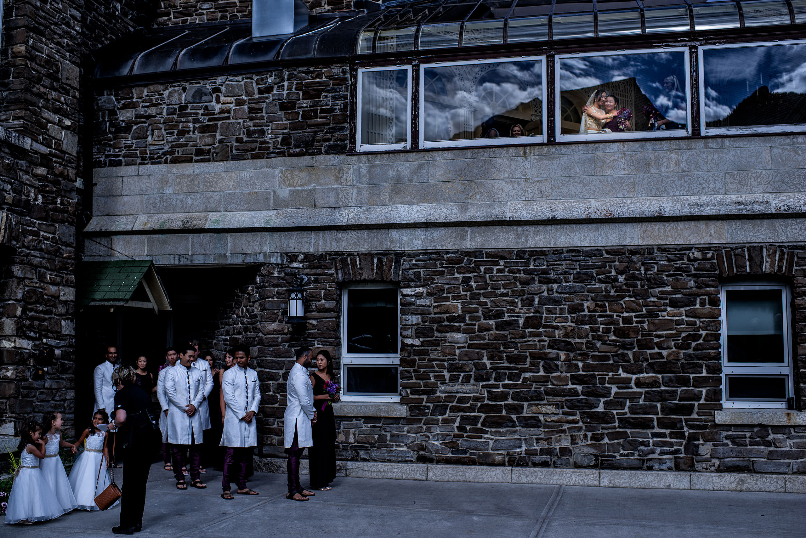 bridal party waiting for ceremony outside of hotel for cascade ballroom banff springs wedding by sean leblanc