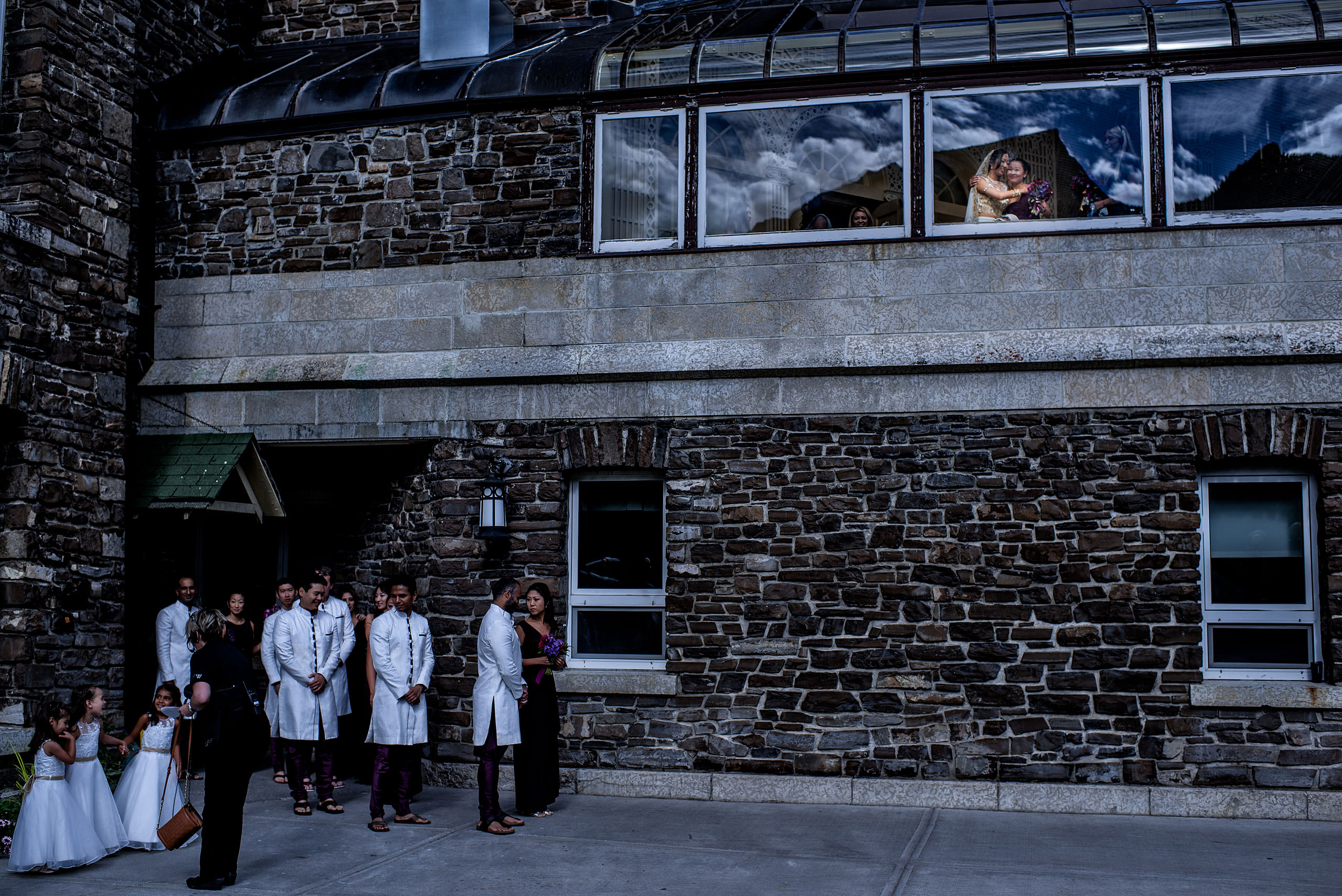 bridal party waiting for ceremony outside of hotel for cascade ballroom banff springs wedding by sean leblanc