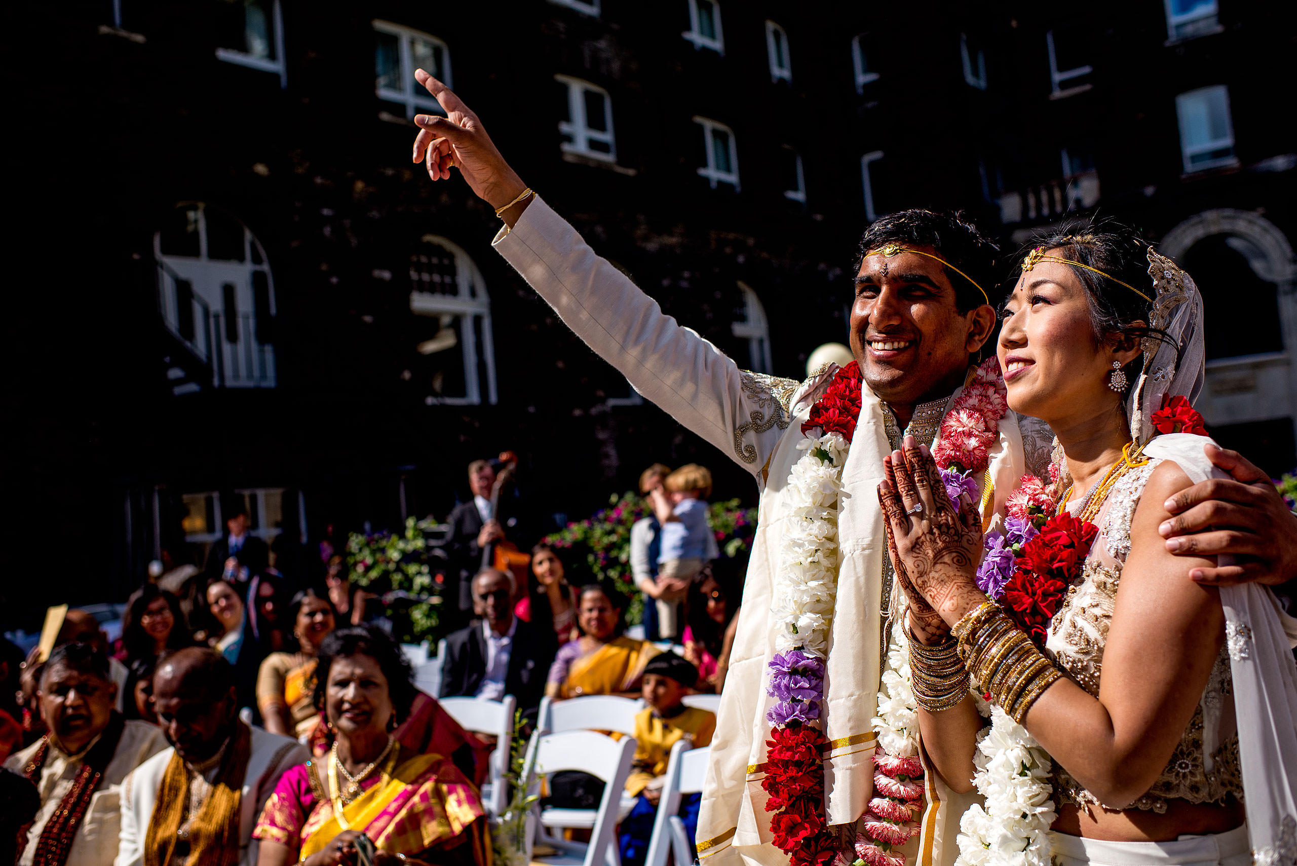 groom raising arm for cascade ballroom banff springs wedding by sean leblanc