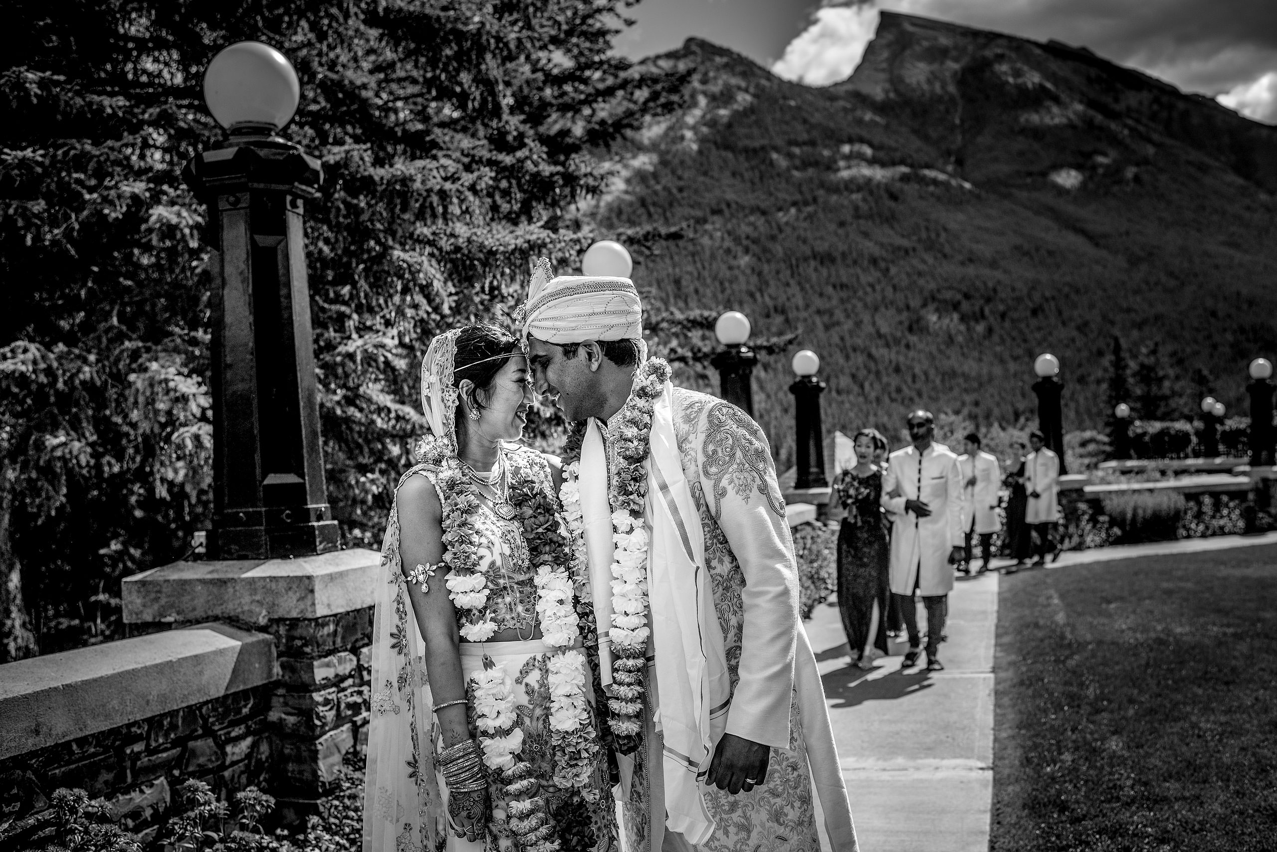 indian groom kissing bride for cascade ballroom banff springs wedding by sean leblanc