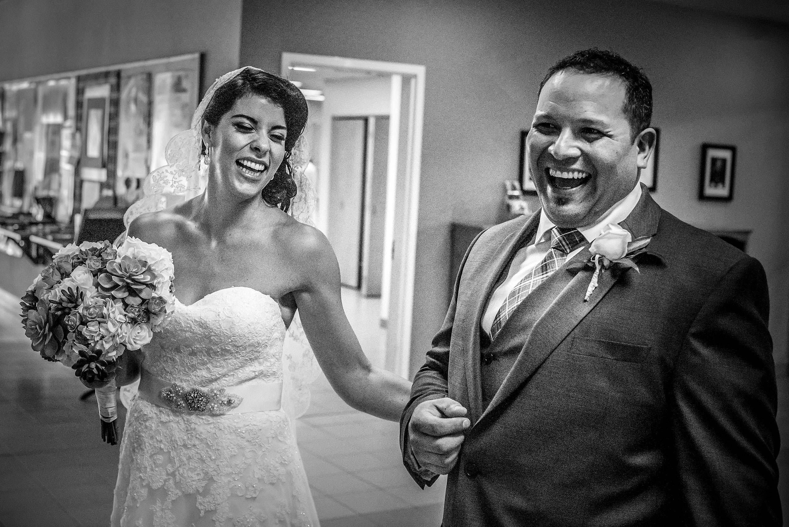 a bride and groom laughing with each other by Edmonton wedding photographer sean leblanc