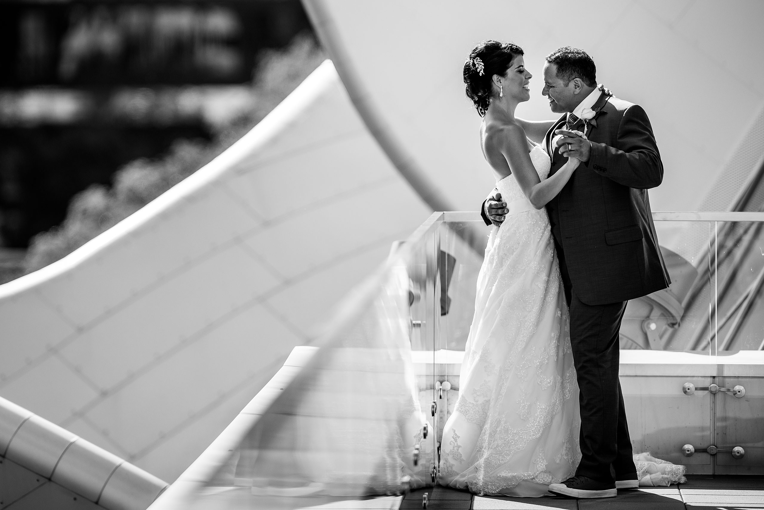 a bride and groom dancing on the roof of the Art Gallery of Alberta by Edmonton wedding photographer sean leblanc