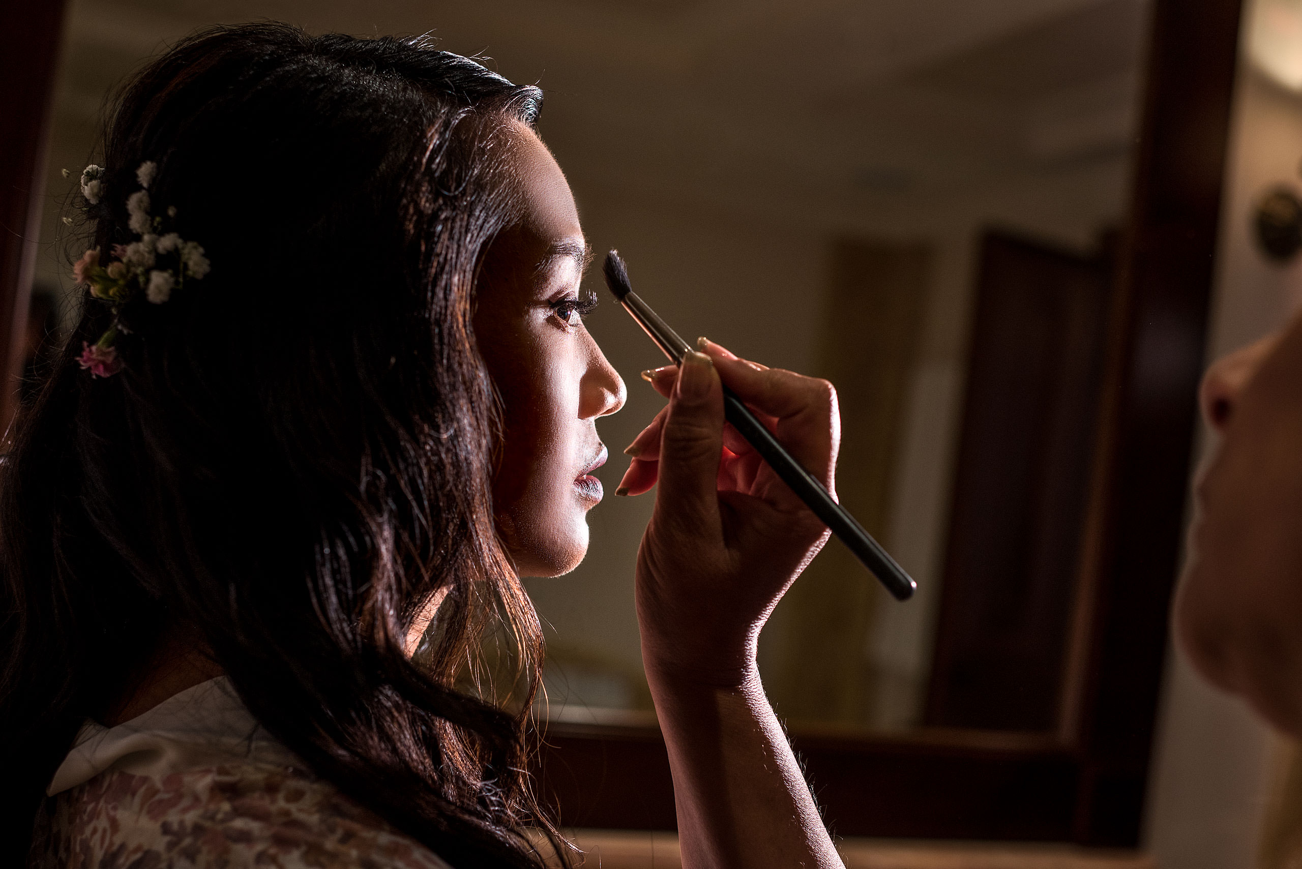 bride getting her makeup put on lit by off camera flash at castillo hotel son vida destination wedding by sean leblanc