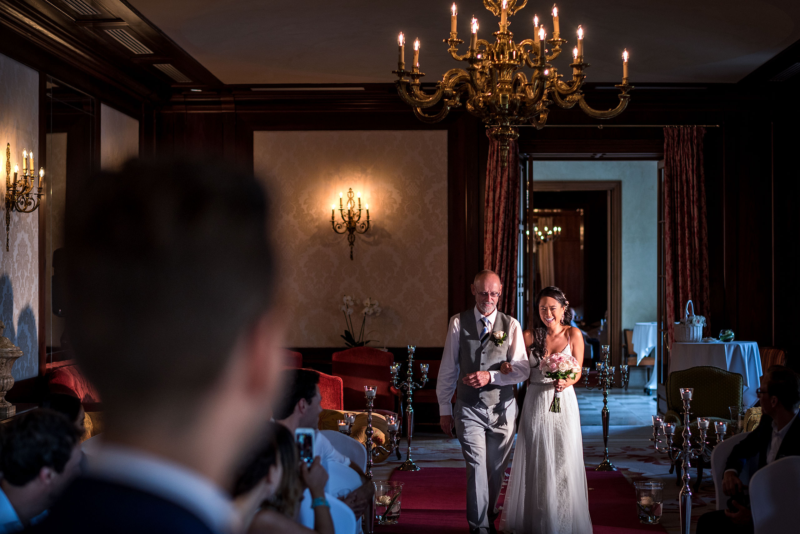 dad walking his daughter down the isle at castillo hotel son vida destination wedding by sean leblanc