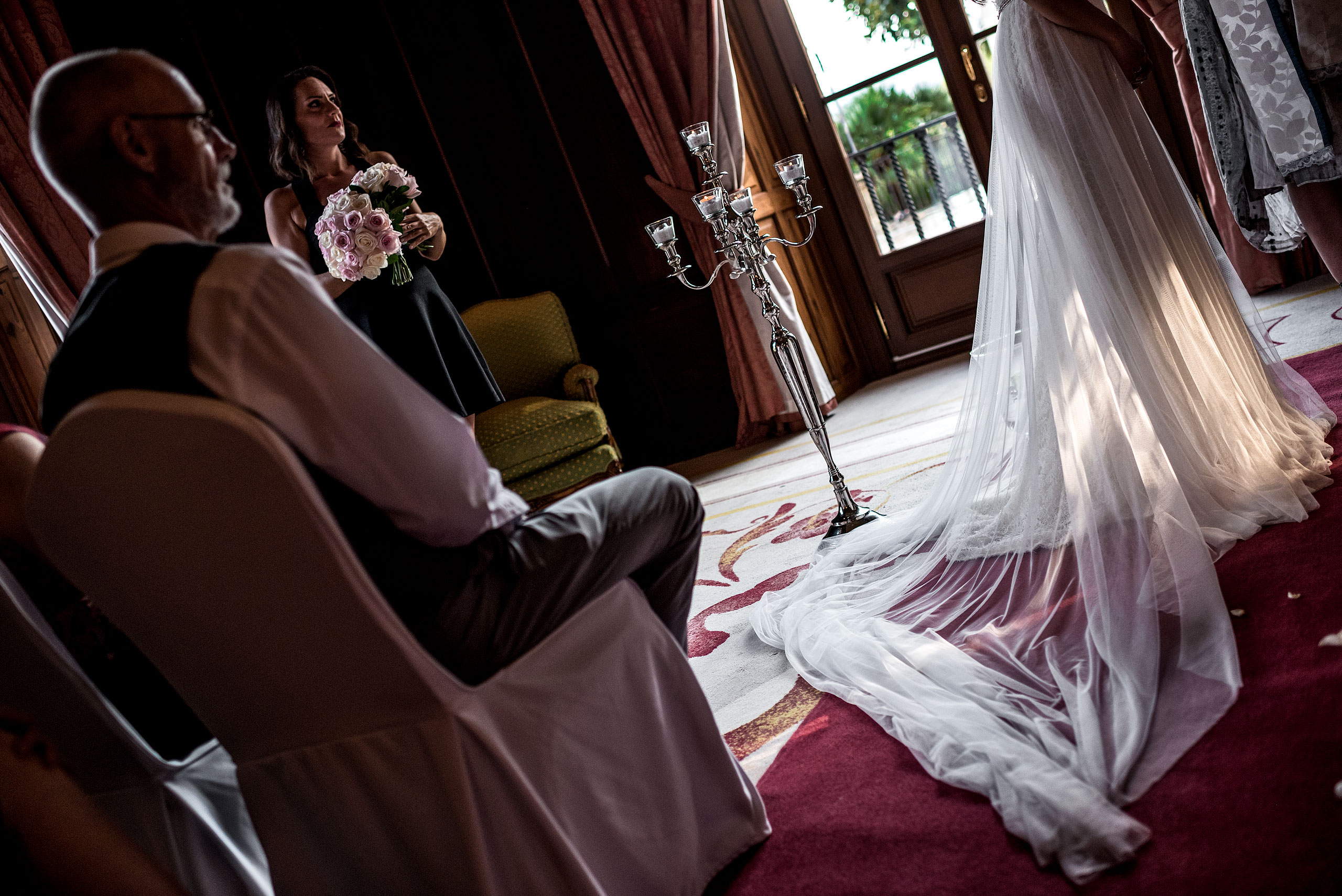 wedding dress lit by sunlight at a ceremony at castillo hotel son vida destination wedding by sean leblanc