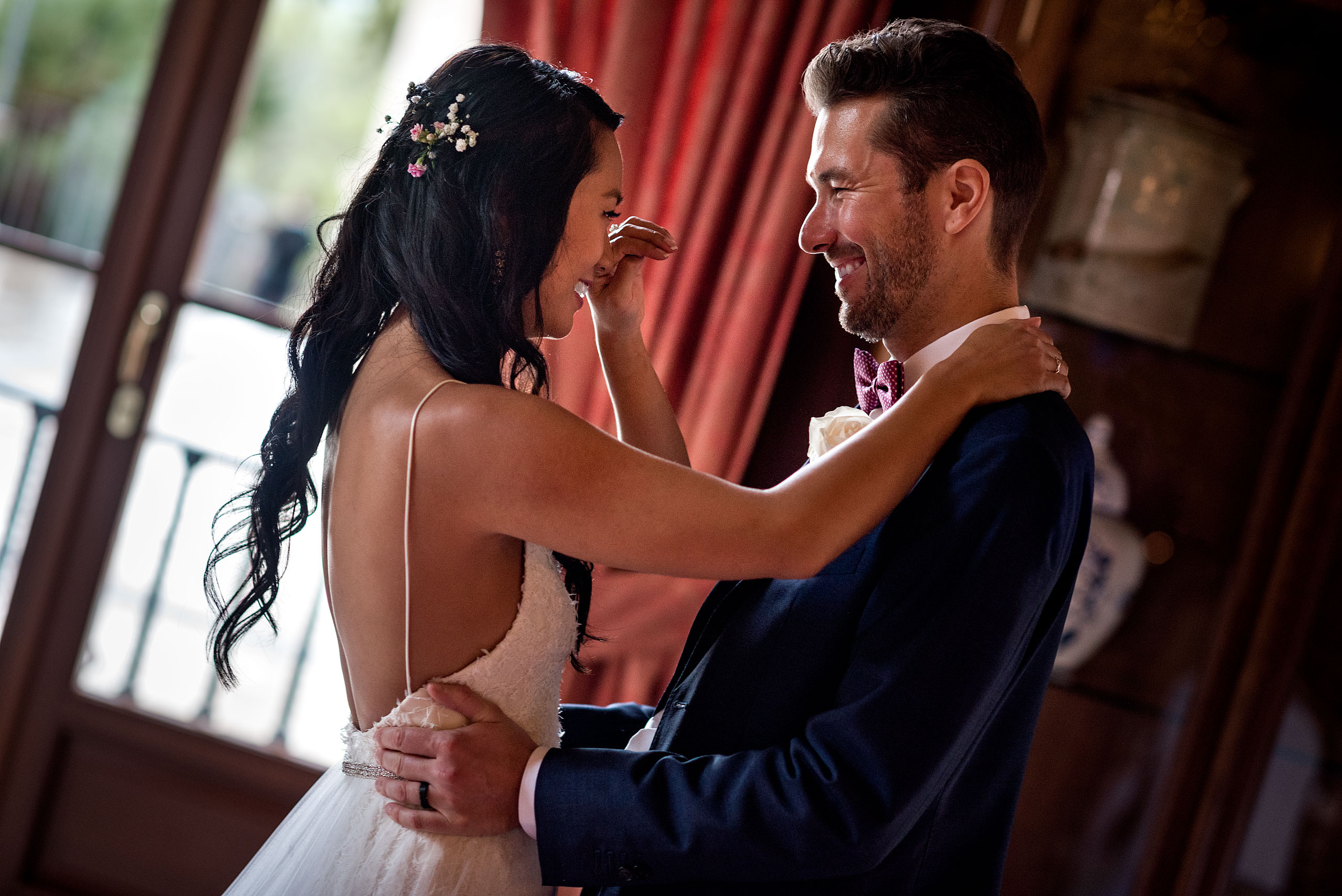 a bride and groom embracing after getting married at castillo hotel son vida destination wedding by sean leblanc