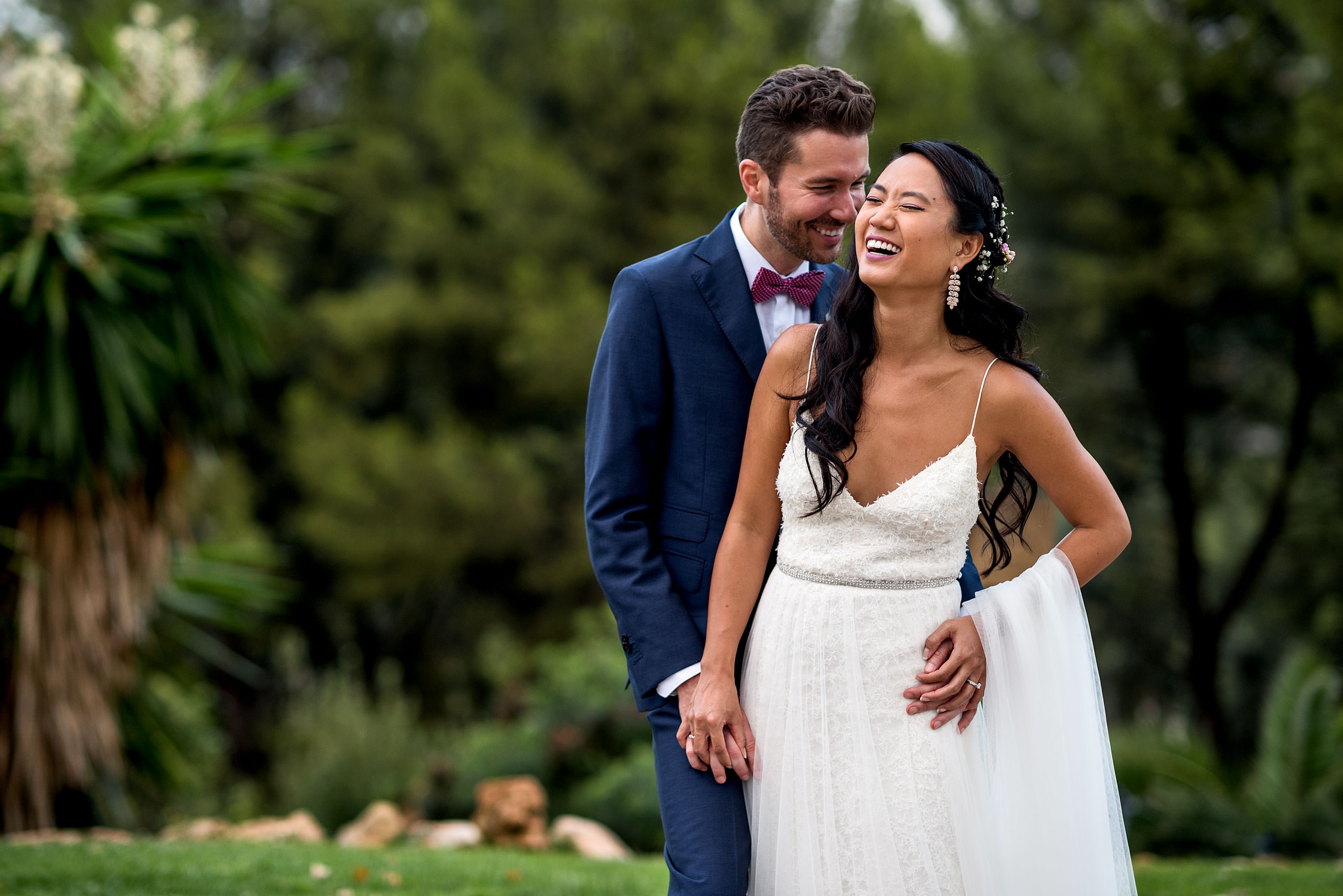 a bride and groom laughing together at castillo hotel son vida destination wedding by sean leblanc