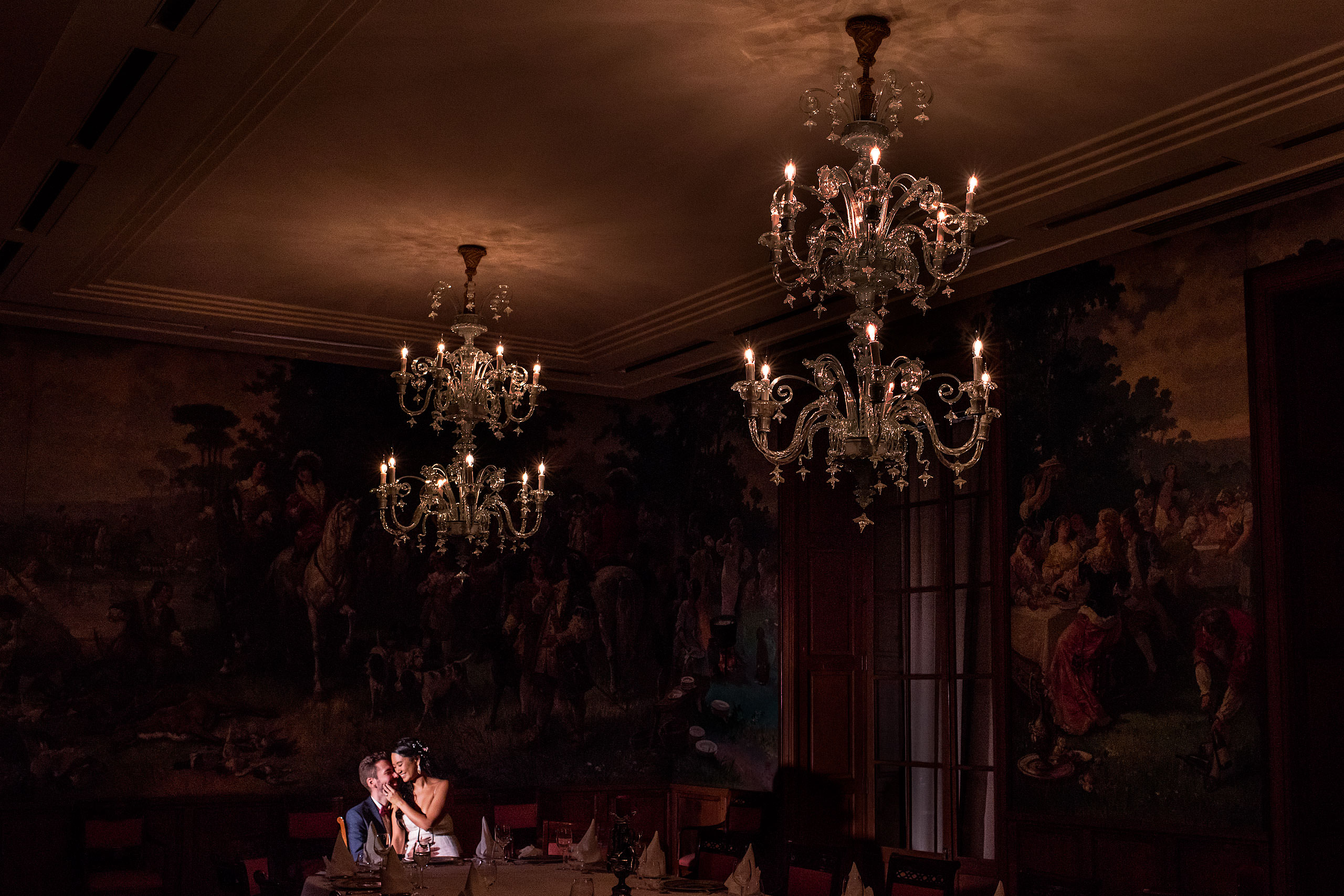 bride and groom loving on each other in an old Spanish room at castillo hotel son vida destination wedding by sean leblanc