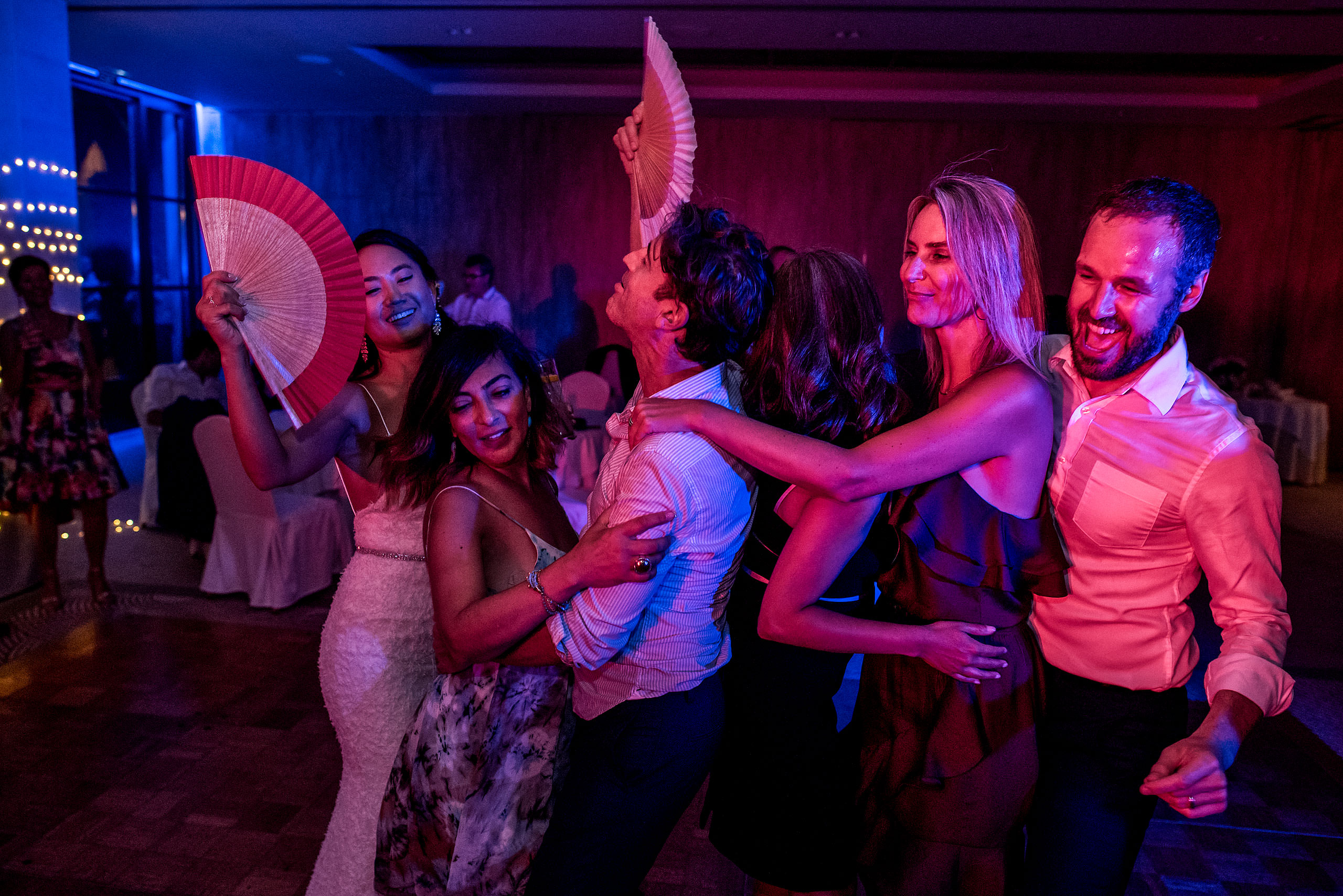 five people dancing together at castillo hotel son vida destination wedding by sean leblanc