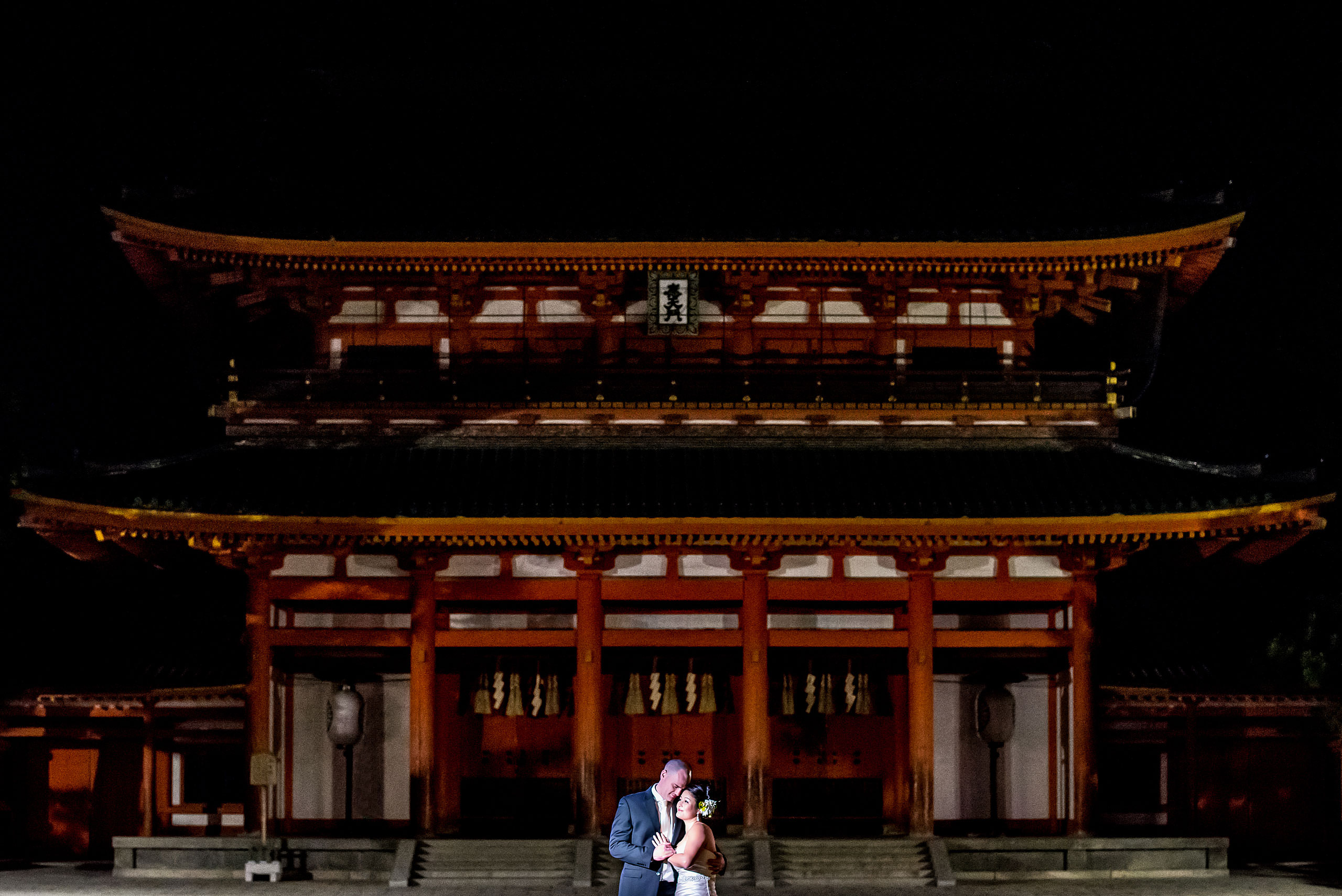 a bride and groom in front of a Japanese temple by Japan Destination Wedding Photographer Sean LeBlanc