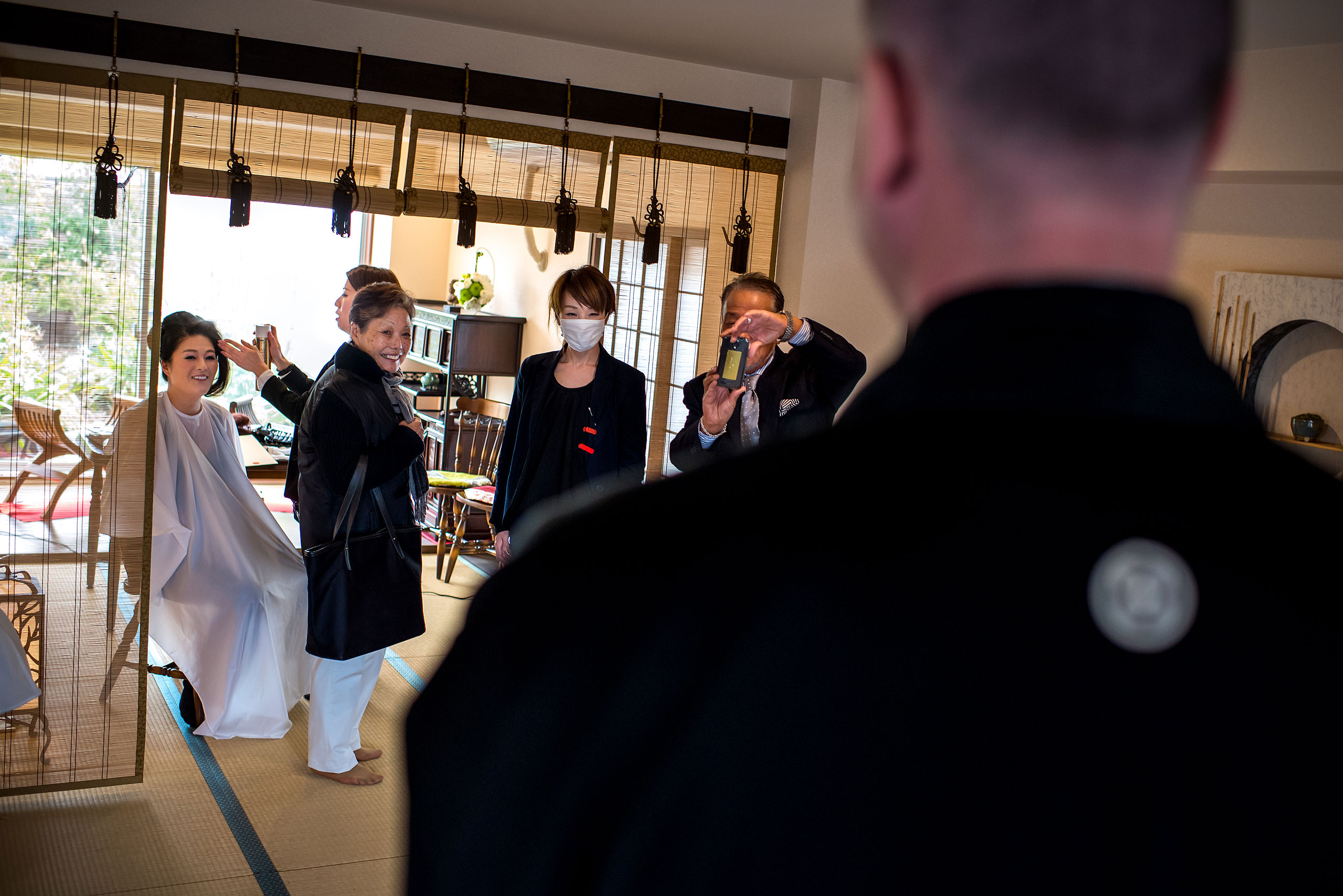 a Japanese family smiling at a groom by Japan Destination Wedding Photographer Sean LeBlanc