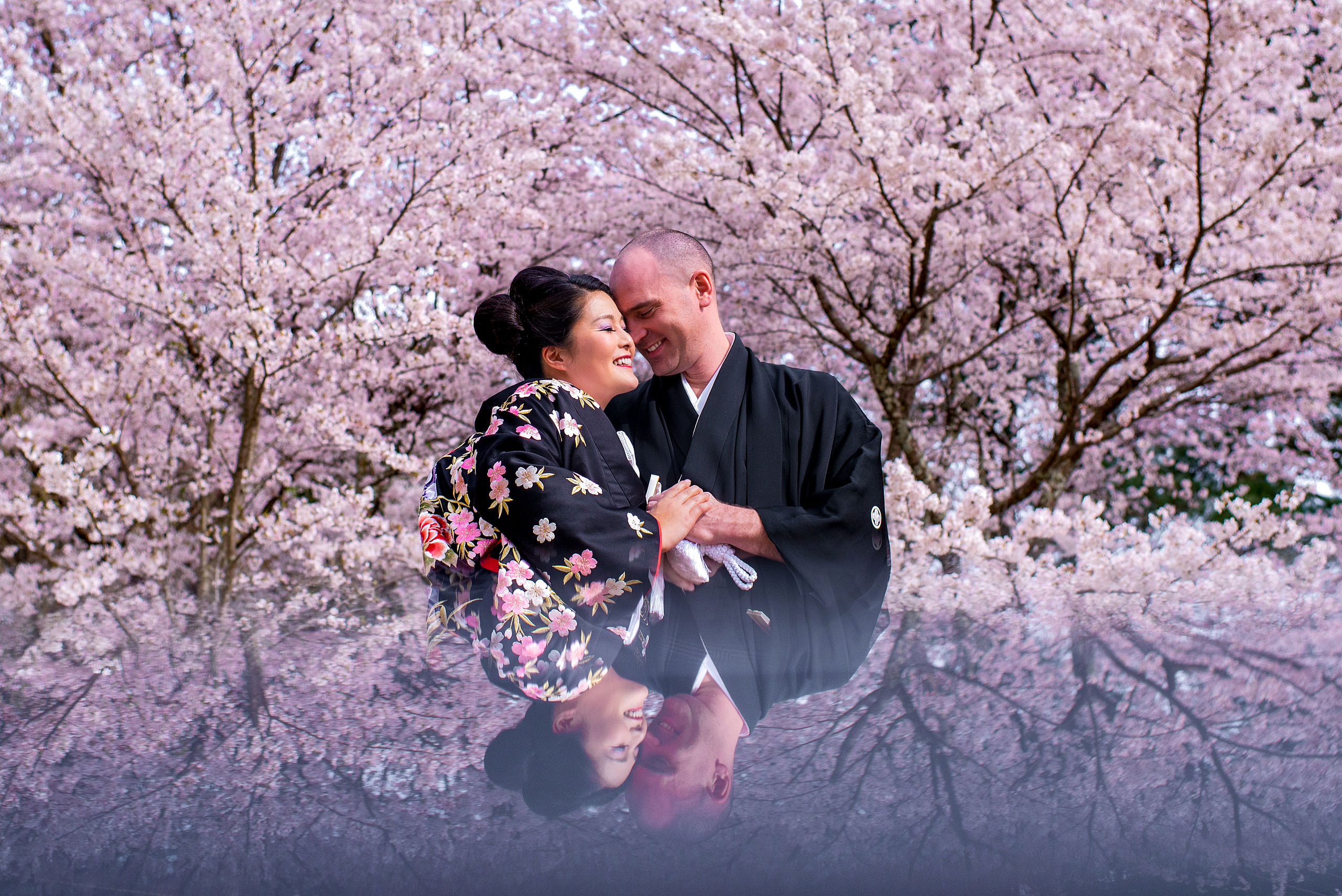 a Japanese bride and groom in front of a cherry blossom tree by Japan Destination Wedding Photographer Sean LeBlanc