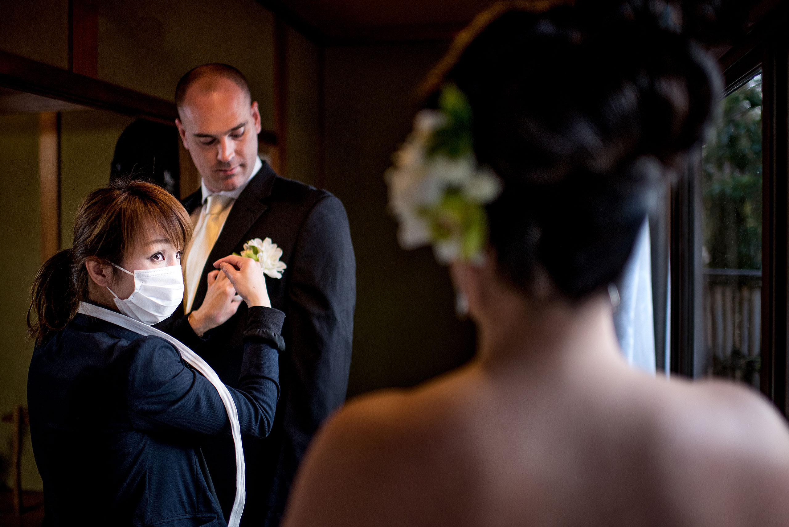 a groom getting ready for a reception by Japan Destination Wedding Photographer Sean LeBlanc