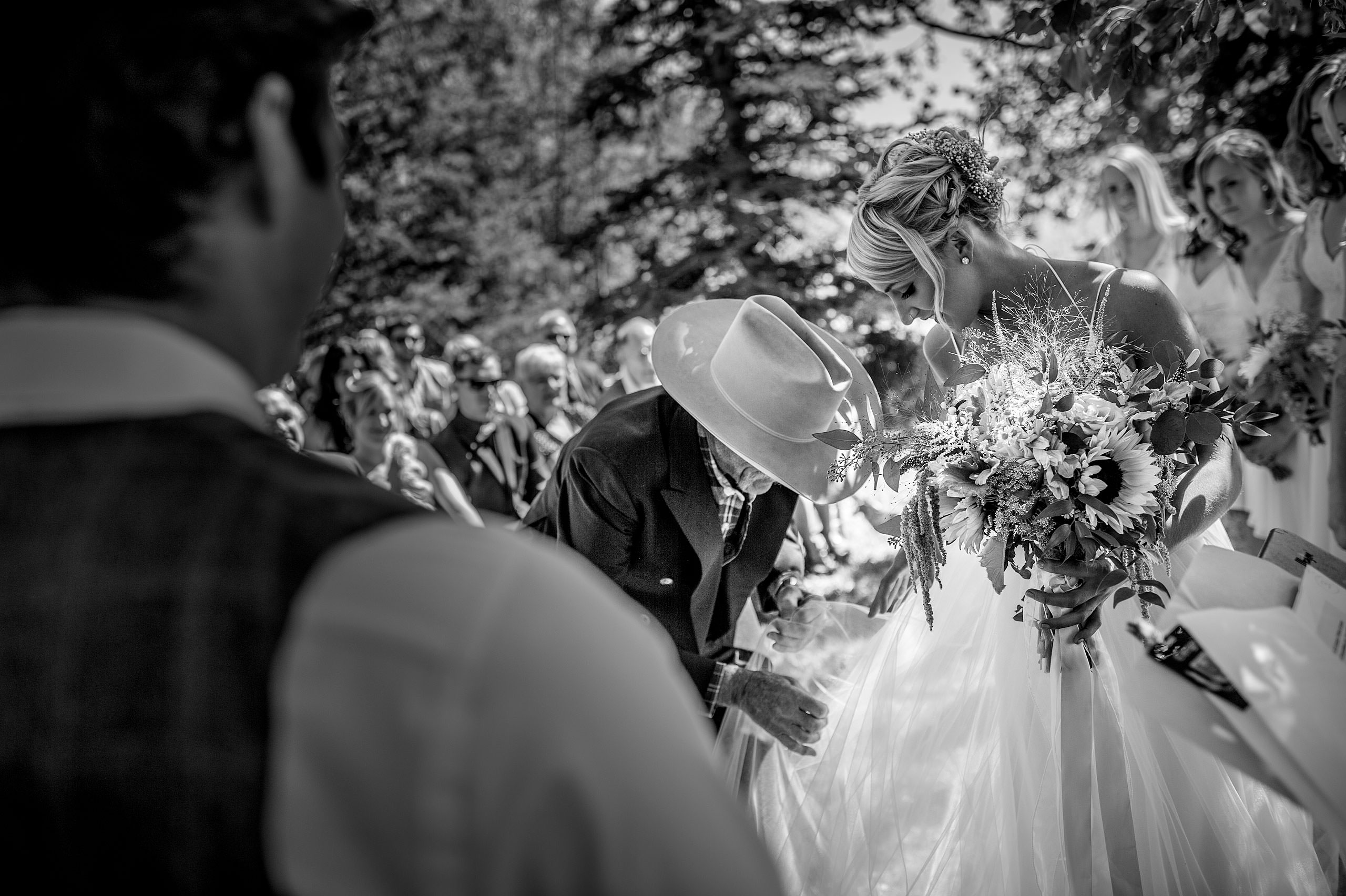 a bride's dad helping her with her dress at Cochrane Country Wedding by Sean LeBlanc