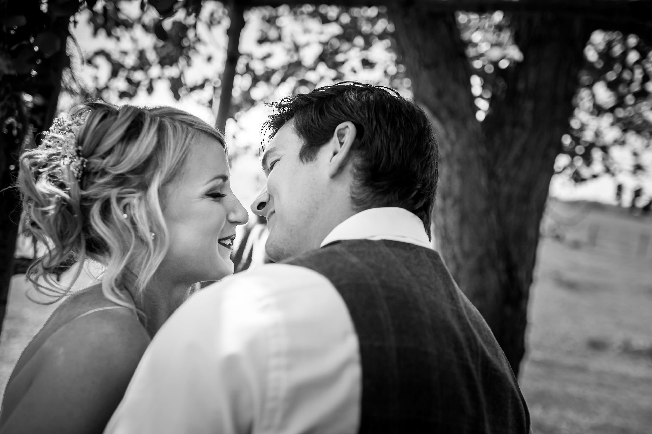 a bride and groom about to kiss at their wedding ceremony at Cochrane Country Wedding by Sean LeBlanc