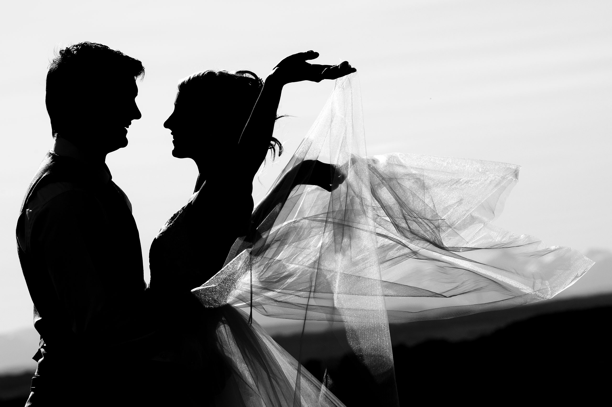 a silhouette of a bride and groom at Cochrane Country Wedding by Sean LeBlanc