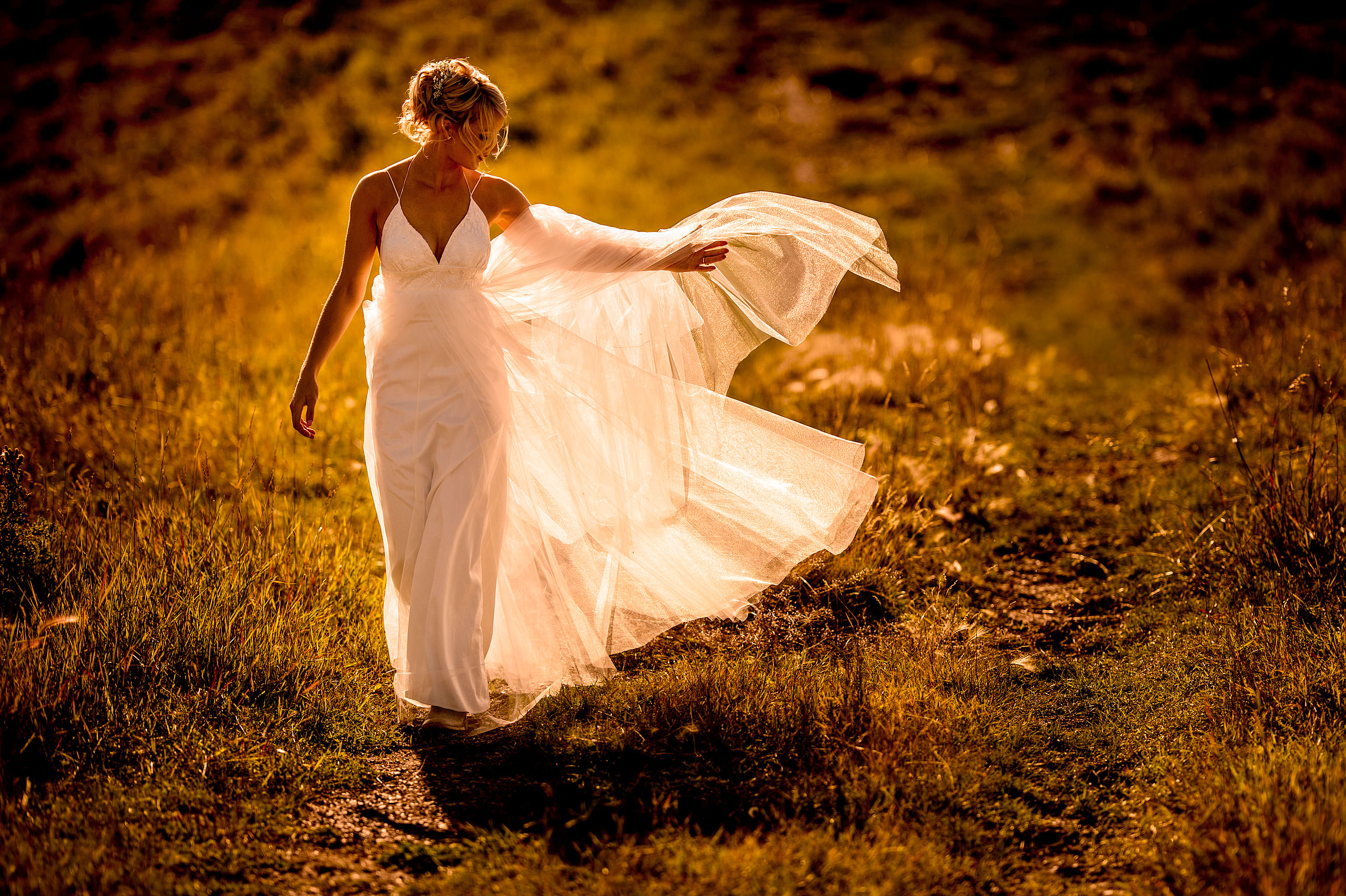 bride flipping her dress by top calgary wedding photographer sean leblanc