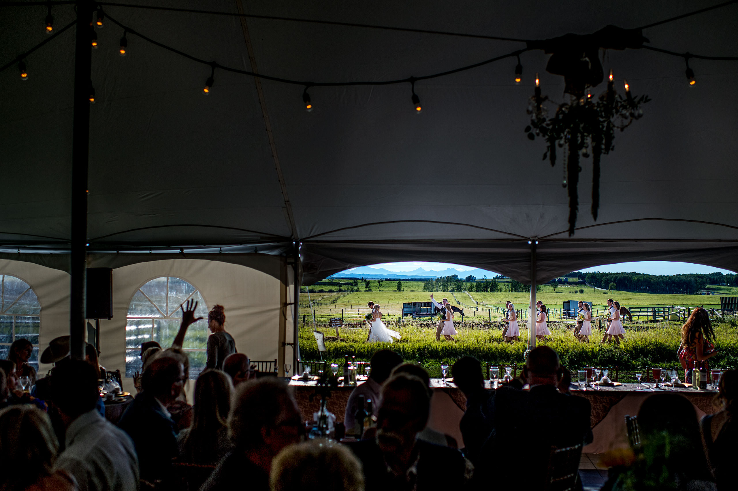 bridal party making an entrance to the reception at Cochrane Country Wedding by Sean LeBlanc