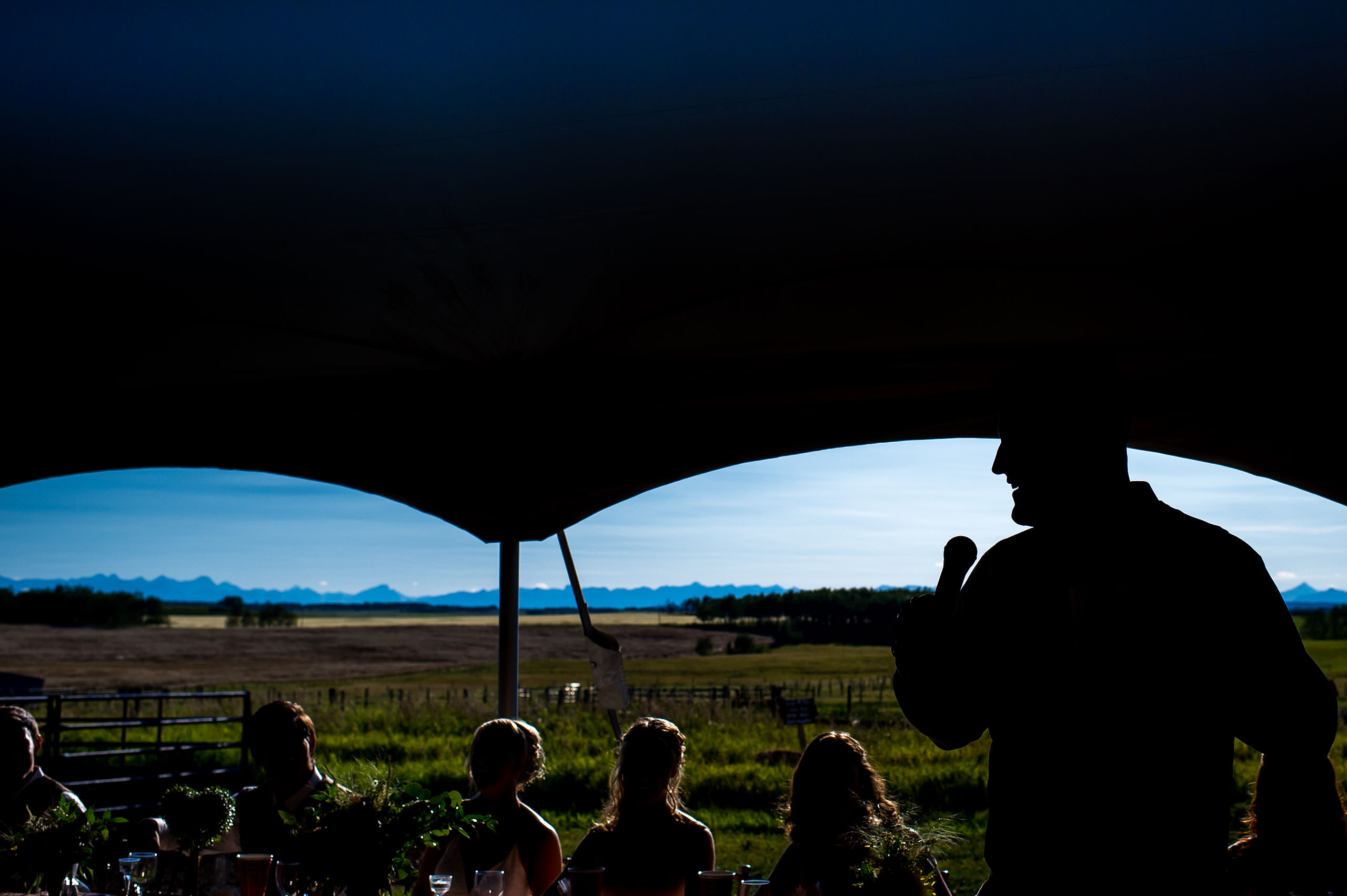 best man giving a speech at a wedding reception at Cochrane Country Wedding by Sean LeBlanc