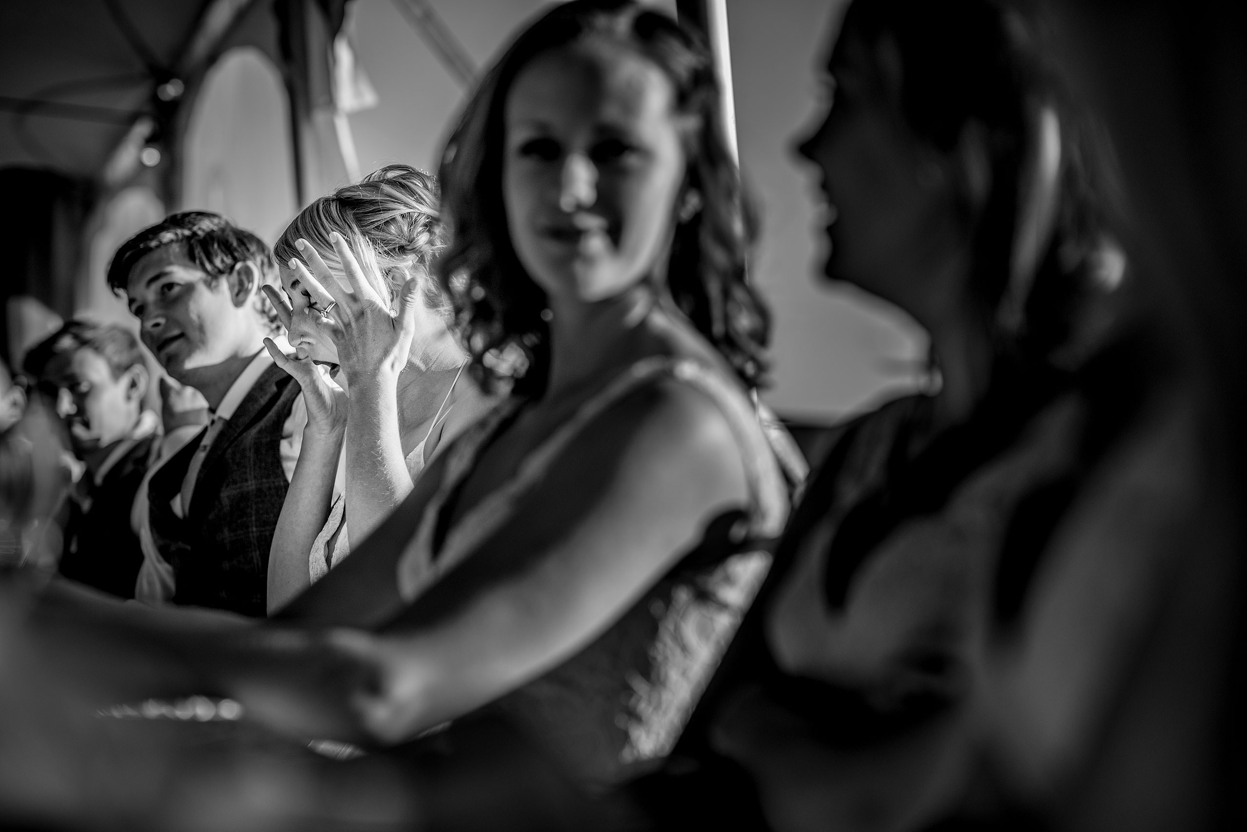 a bride wiping tears from her eyes at Cochrane Country Wedding by Sean LeBlanc