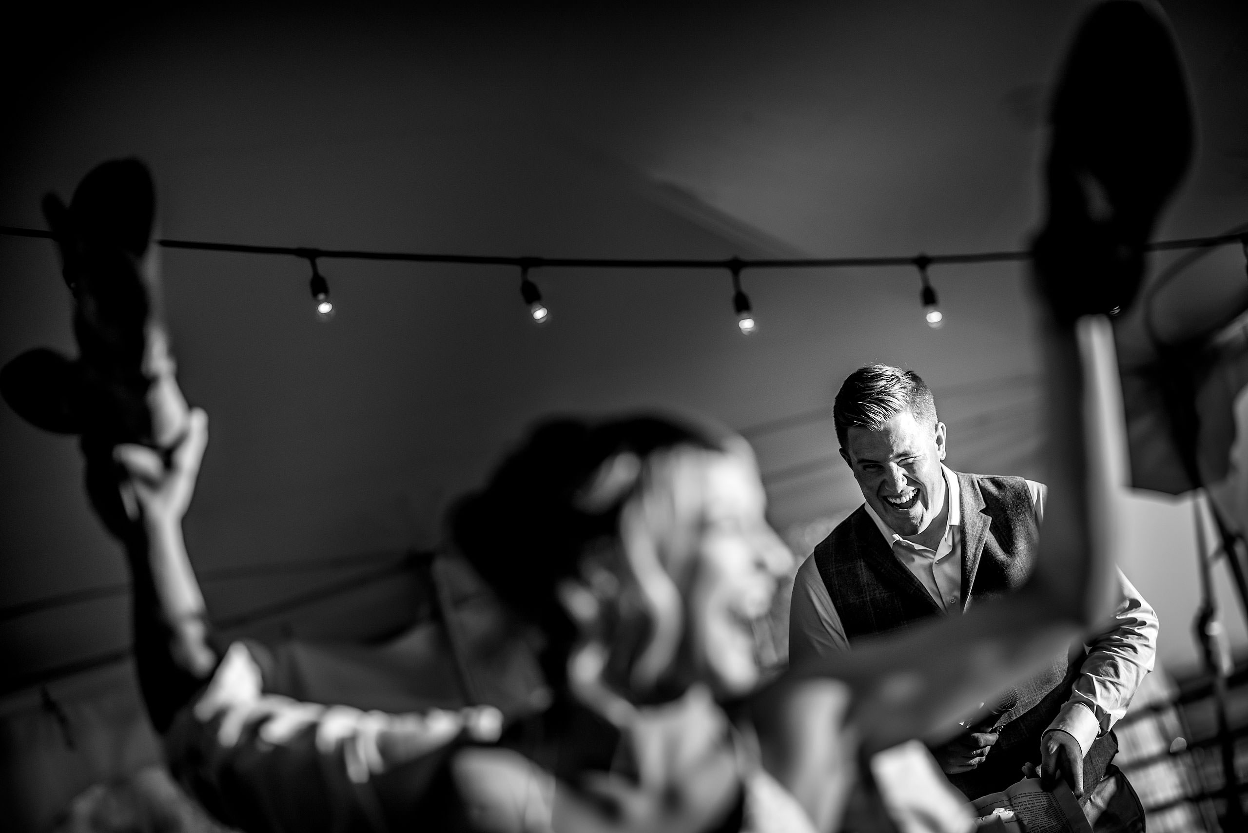 the best man at a wedding reception laughing at Cochrane Country Wedding by Sean LeBlanc