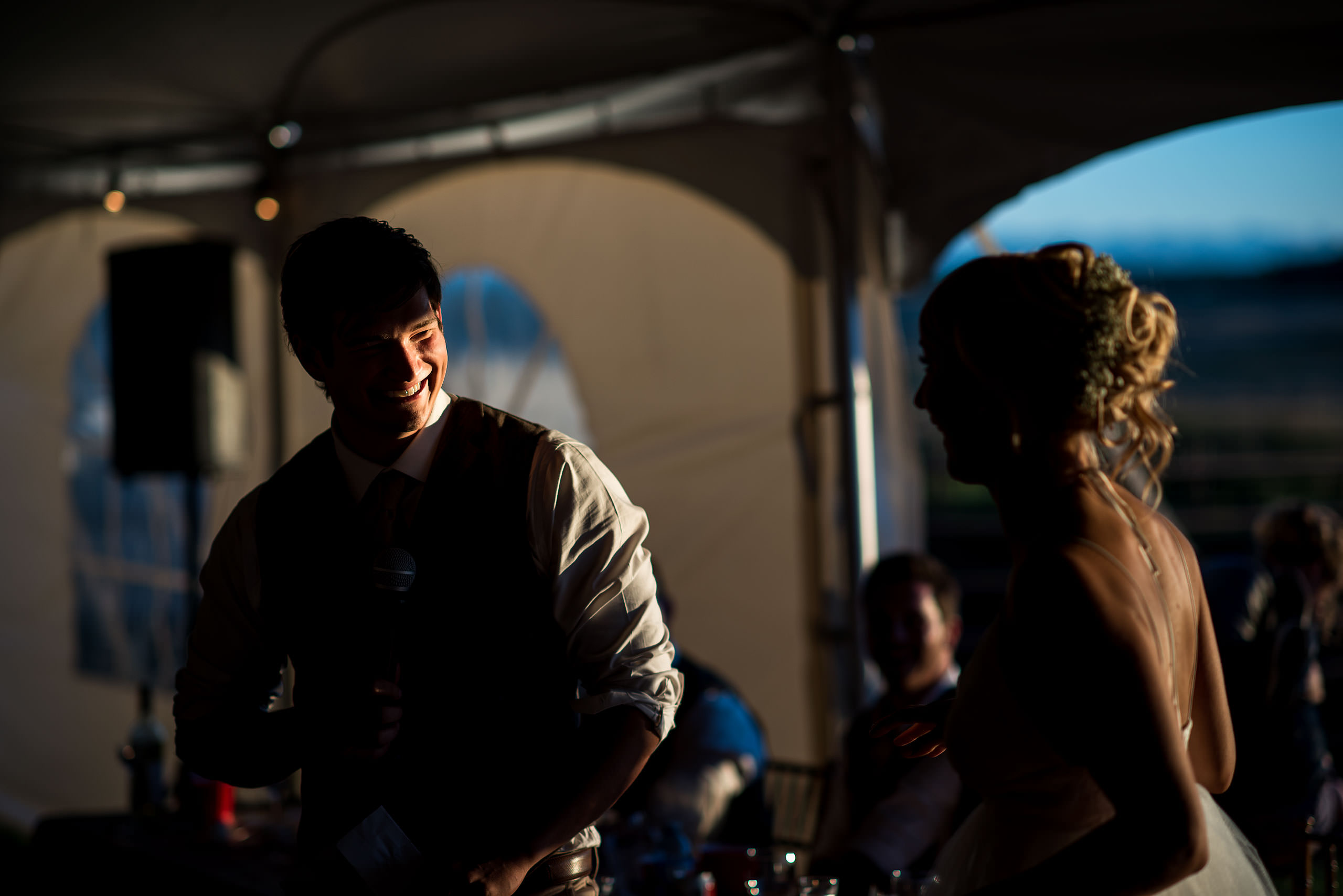 a groom laughing with his bride at Cochrane Country Wedding by Sean LeBlanc