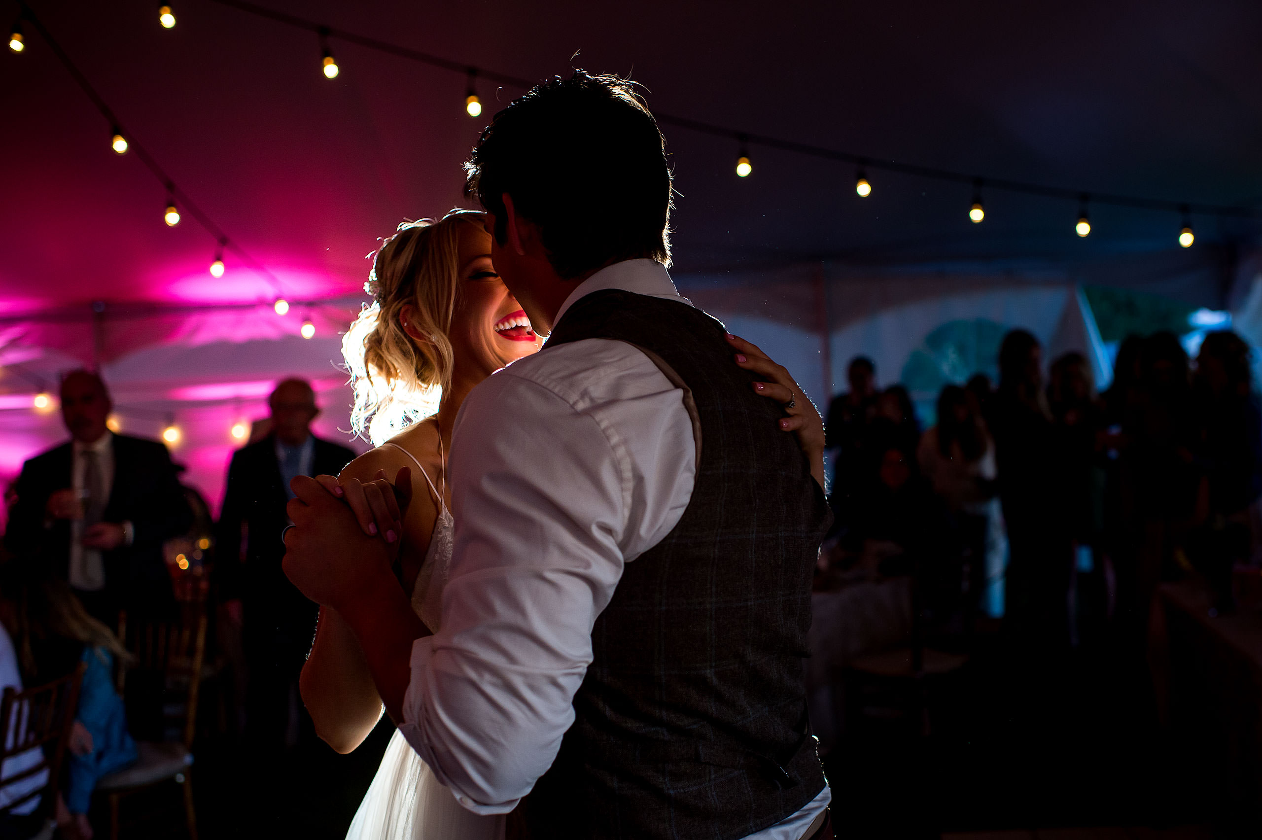 the first dance of a bride and groom in a tent at Cochrane Country Wedding by Sean LeBlanc