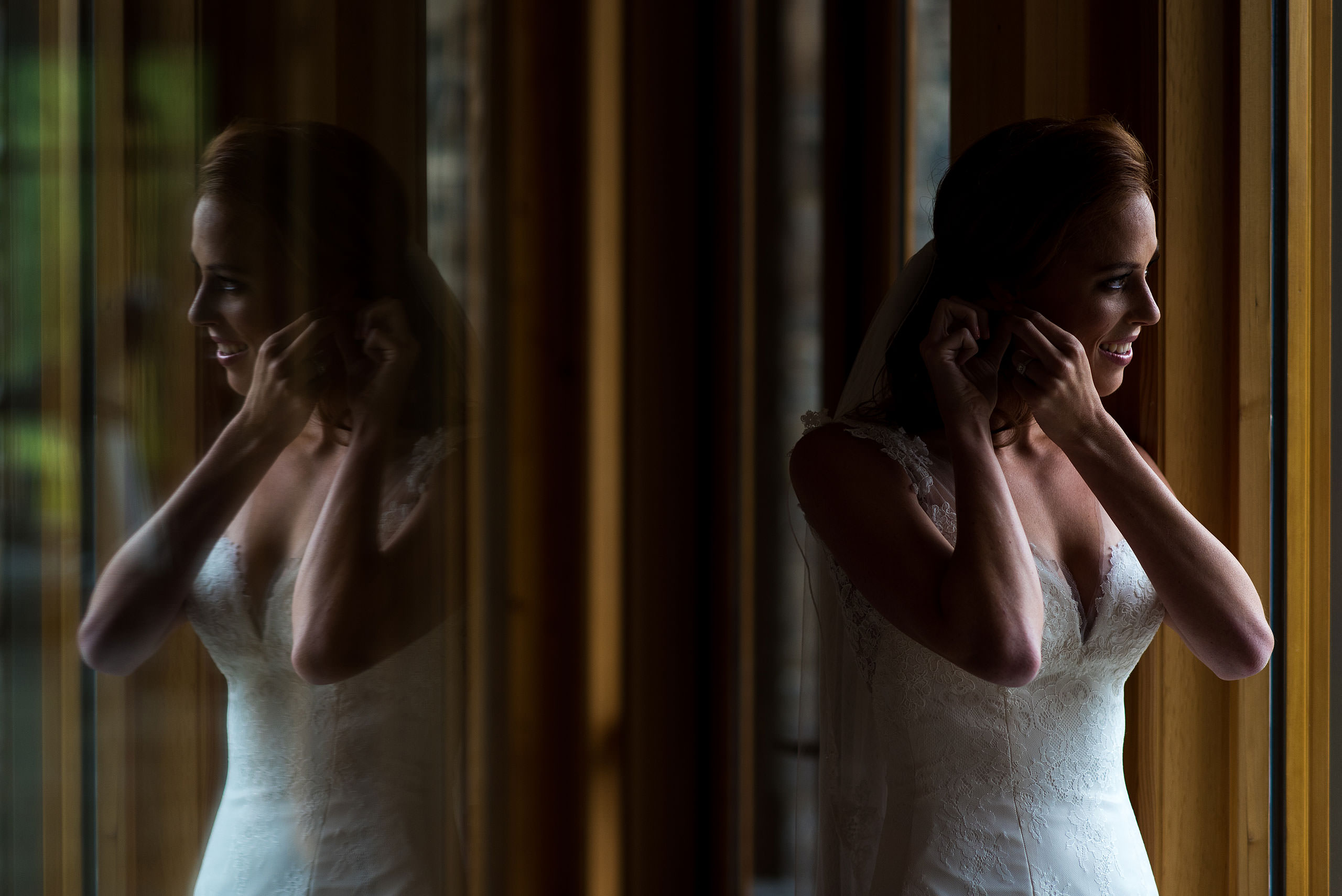 a bride adjusting her earring at Priddis Azuridge Wedding by sean leblanc