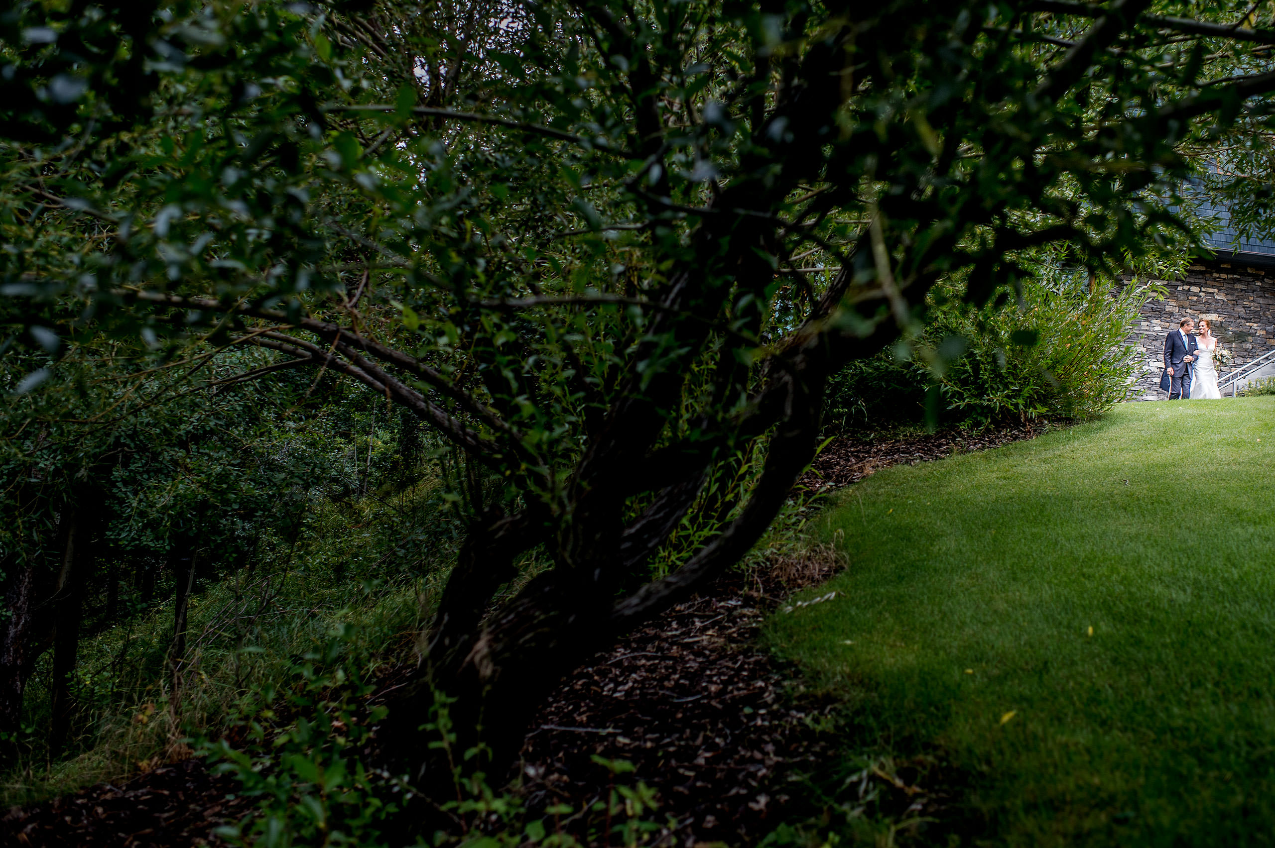 a bride and her dad walking at Priddis Azuridge Wedding by sean leblanc