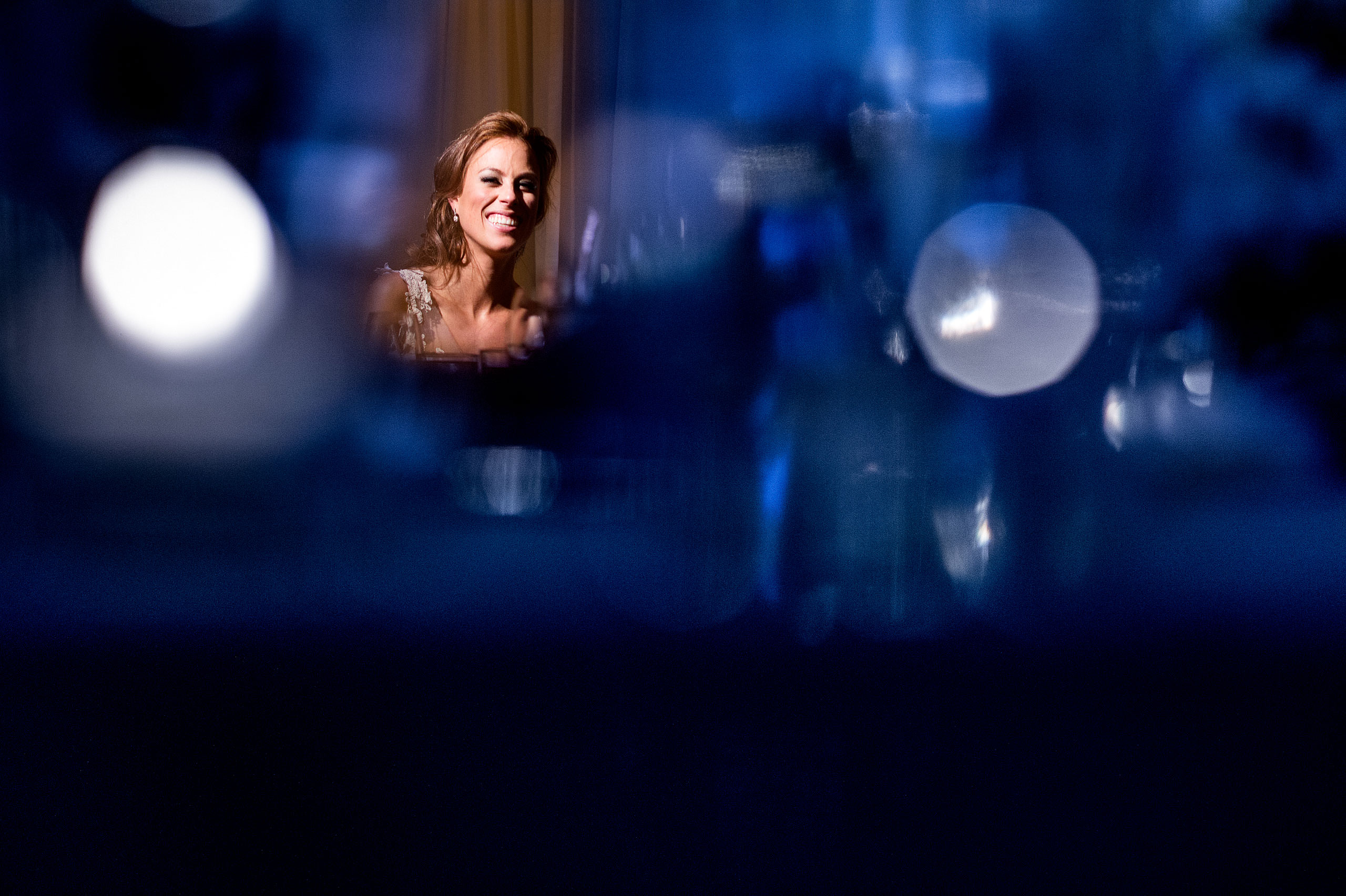 a bride smiling at Priddis Azuridge Wedding by sean leblanc